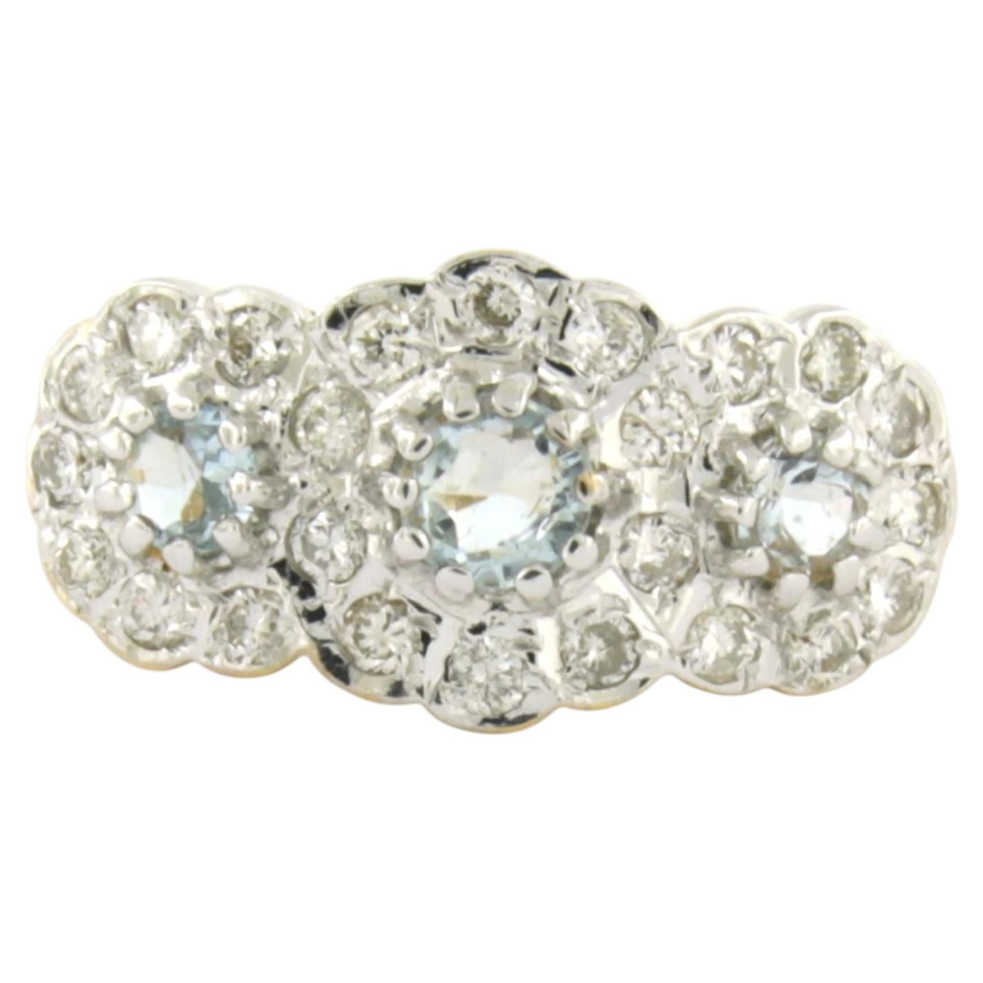 Ring mit Topas und Diamanten im Brillantschliff bis zu 0,30 ct aus 18 Karat Gold