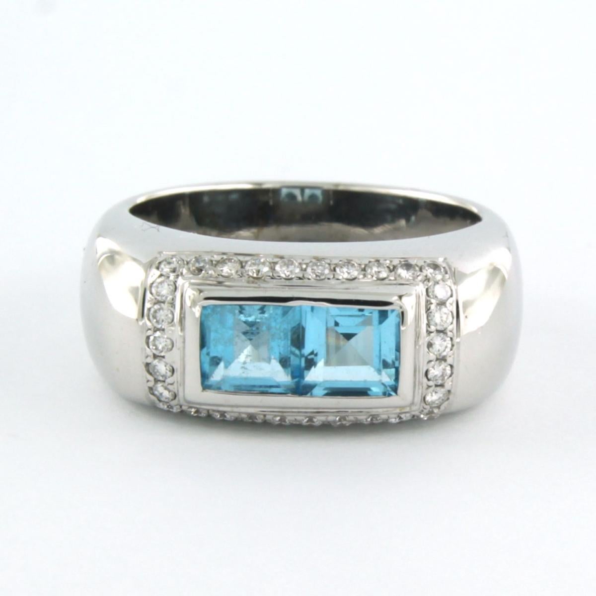 18k white gold ring set with blue topaz and brilliant cut diamonds. 0.30ct - F/G - VS/SI - ring size U.S. 8 - EU. 18.25 (57)

detailed description:

the top of the ring is 8.9 mm wide

Ring size US 8 - EU. 18.25 (57), ring can be enlarged or reduced