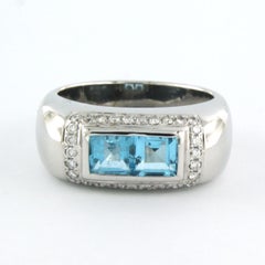 Ring with topaz and brilliant cut diamonds up to 0.30ct 18k white gold