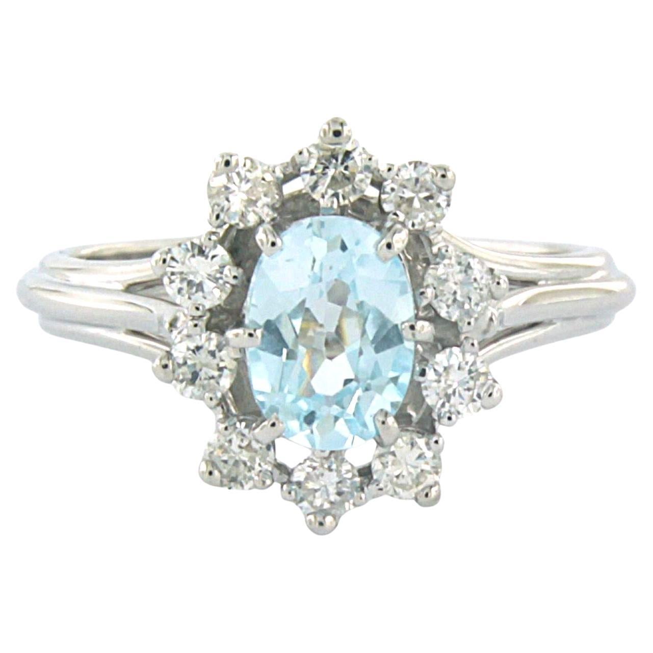 Ring with topaz and brilliant cut diamonds up to 0.30ct 18k white gold