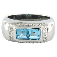Ring with topaz and brilliant cut diamonds up to 0.30ct 18k white gold