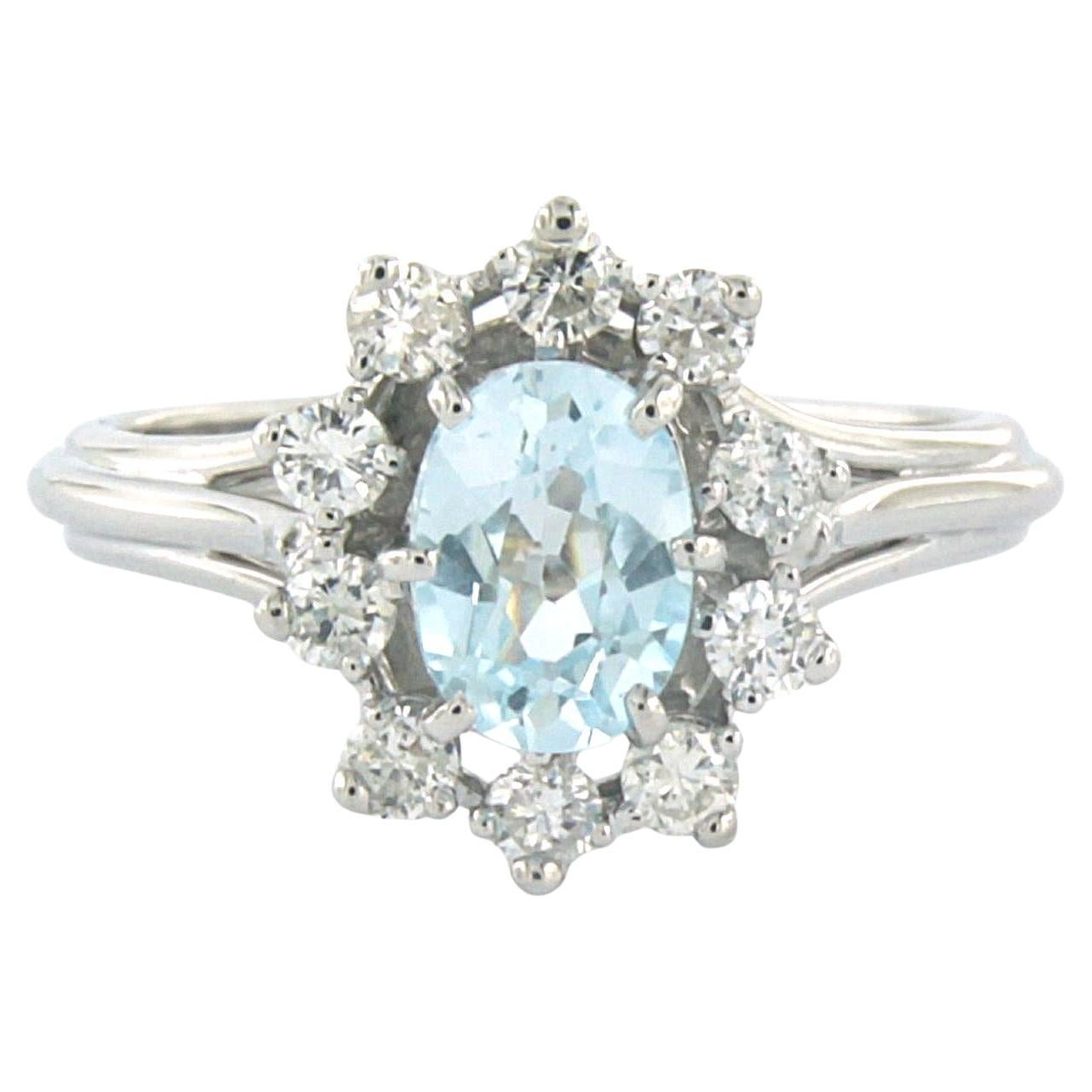 Bague avec topaze et diamants taille brillant jusqu
à 0,40ct Or 18k 4,0 grammes