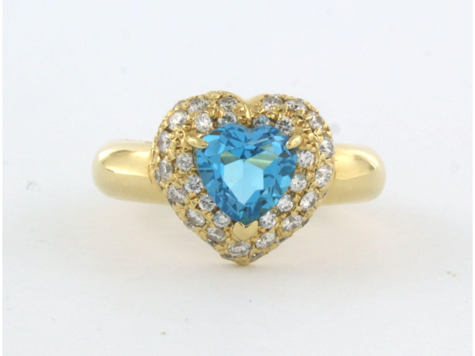 18k yellow gold ring set with blue topaz and brilliant cut diamonds. 0.61ct - F/G - VS/SI - ring size U.S. 5.25 - EU. 16 (50)

detailed description:

the top of the ring is 1.2 cm wide by 6.2 mm wide

weight 8.8 grams

ring size US 5.25 - EU. 16