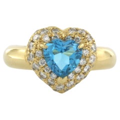 Ring with topaz and diamonds up to 0.61ct 18k yellow gold 