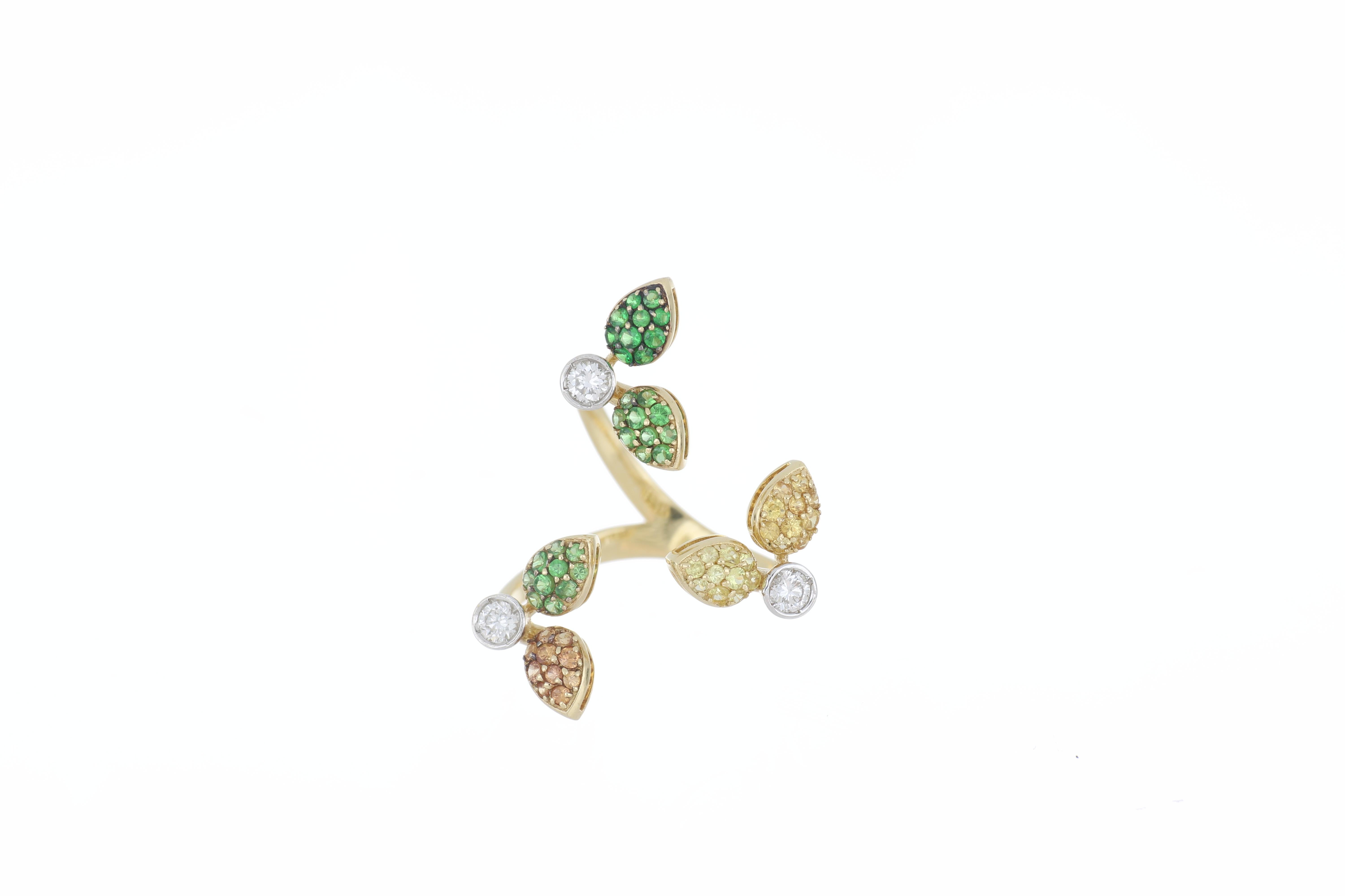 This gorgeous, playful ring was inspired by Pollicino. Small and dainty, this 18k yellow gold ring’s beauty mimics a magical, fairytale. Alluring and enchanting, this ring is made of 3 flowers with green, yellow, and pink petals created with