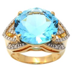 Ring Yellow Gold Blue Topaz 9.40 Carat and Diamonds