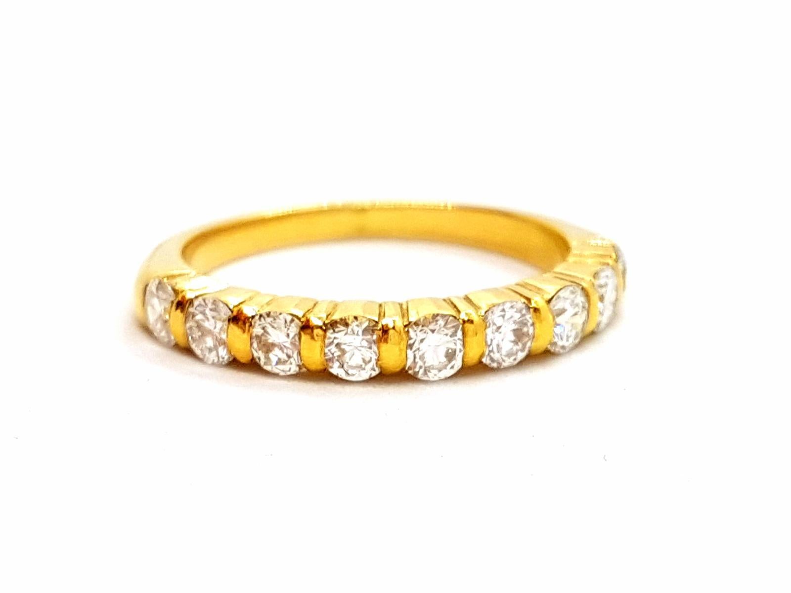 Half alliance gold yellow 750 mils (18 carats). set by 9 round brilliant cut about 0.81 ct total ring size: 56. width on the front: 0.30 cm. total weight: 3.60 g . new. eagle head punch
