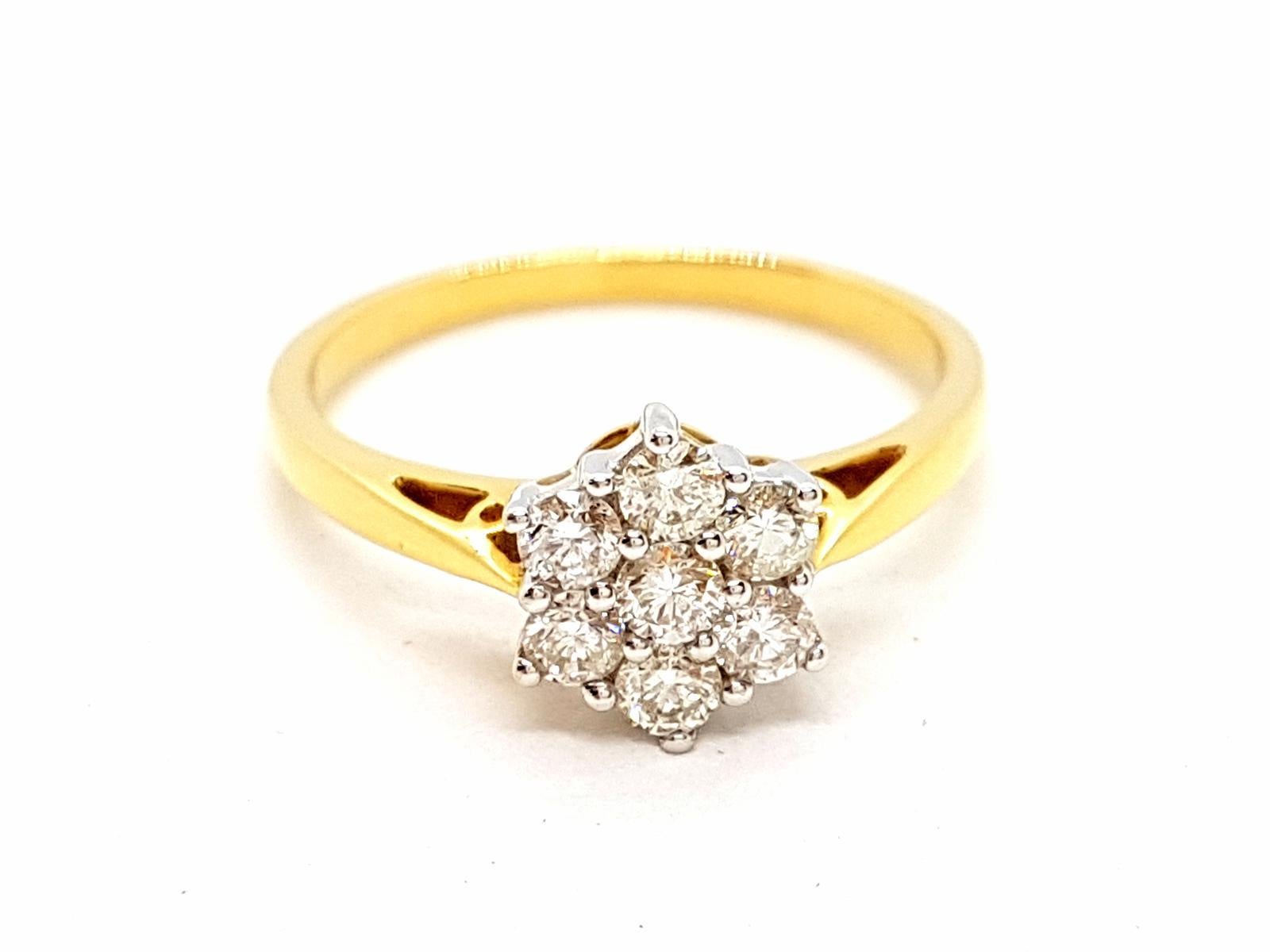 Yellow gold ring 750 mils (18 carats). set with 7 round brilliant cut diamonds 0.50 ct total ring size: 56. width on the front: 0.88 cm. total weight: 3.25 g. punch eagle head. new condition

