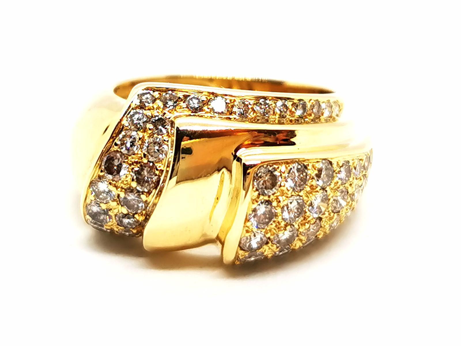 Diamond ring. in 750 thousandths (18 carat) yellow gold. set with 61 diamonds. brilliant cut. for a total of about 1.04. finger circumference: 52. width on top: 1.27 cm. total weight: 10.46 g. half-erased eagle head hallmark. excellent condition

