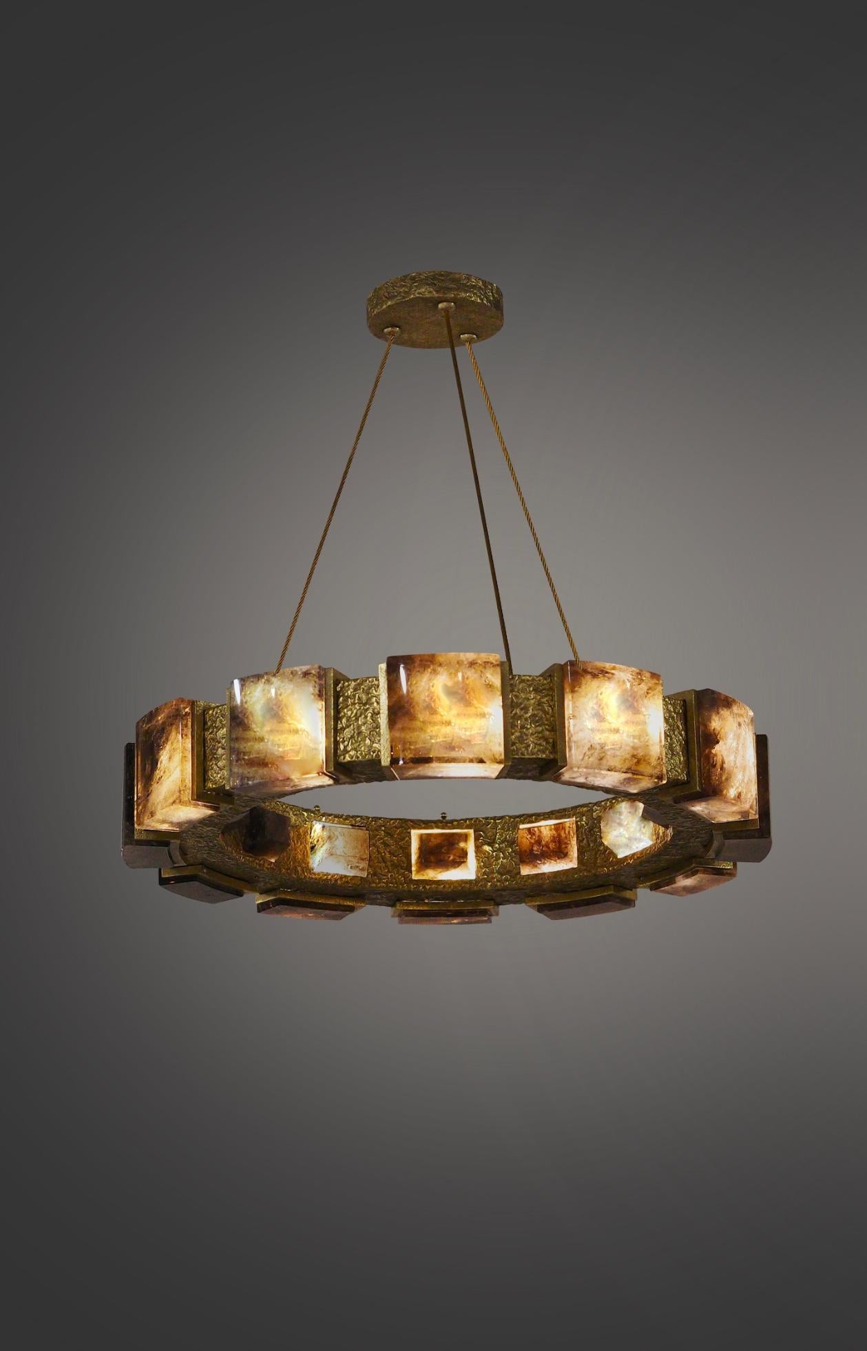 Smoky rock crystal chandelier with hammered brass detail. Created by Phoenix Gallery, NYC.
12 sockets installed. Use 12 of G9 lightbulbs. 60watts each, total 720w max.