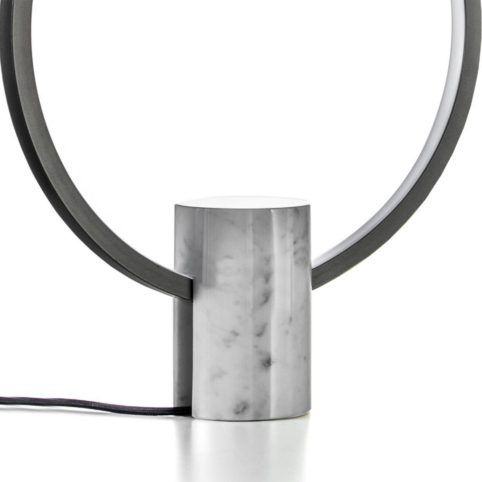 Table lamp Ring'N marble L with carrare white marble
base, with metal ring in tin finish. Ring include a dimmable
led lighting in 2700 Kalvin.
   
