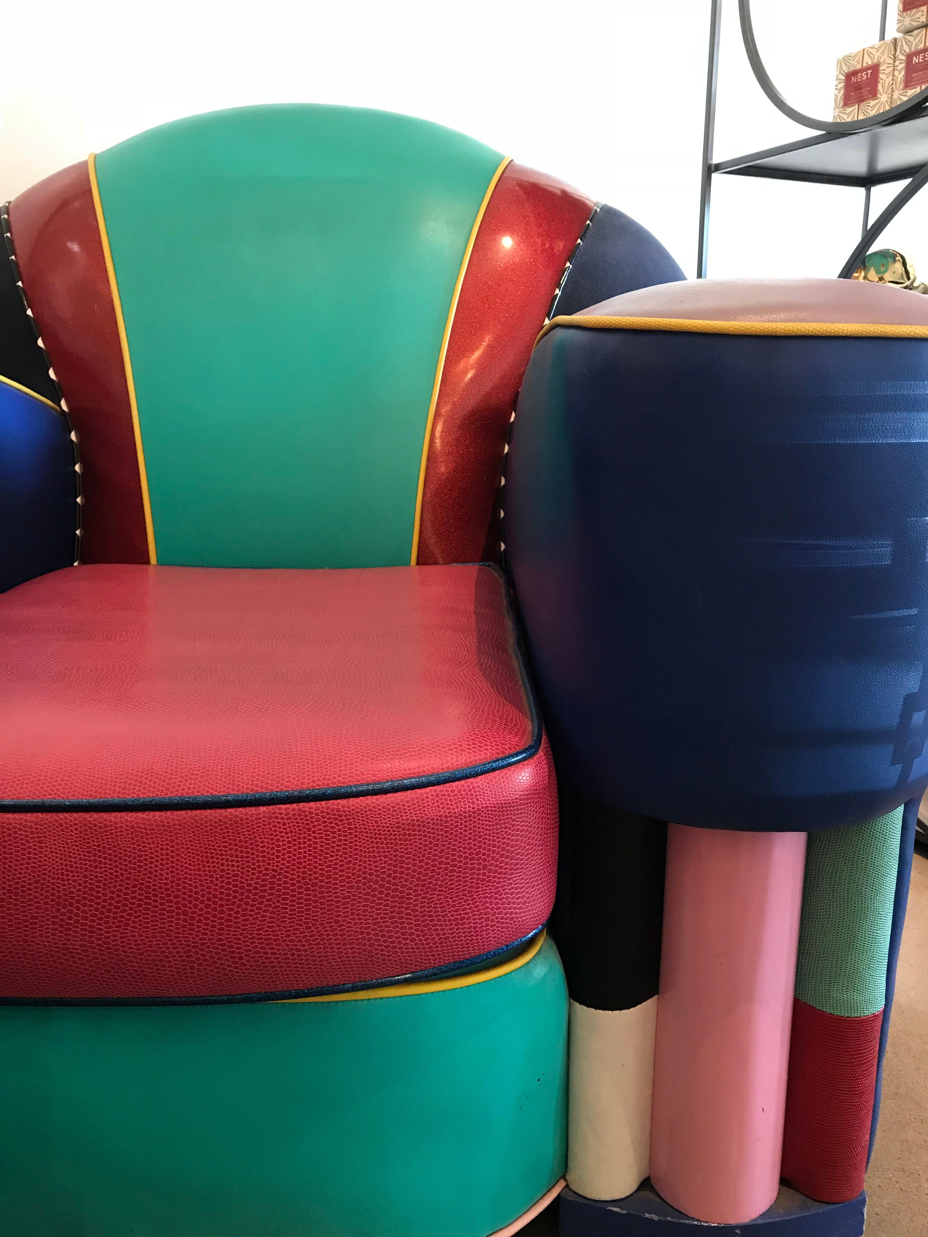 This stunning piece inspired club chair by 1980s designer, Harry Siegel is finished in primary and secondary colored vinyl. It is extremely comfortable and quick a fashion piece!