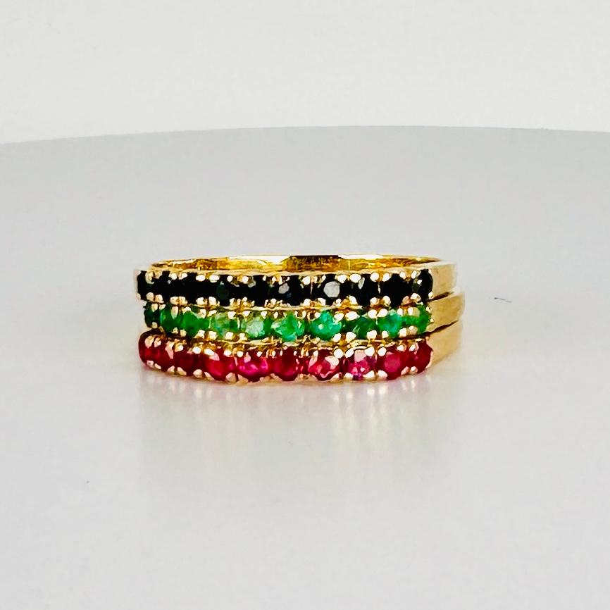 Discover this stunning trio of vintage rings — each set with its own beautiful gemstone: emerald, sapphire, or ruby. Worn together, they form a vibrant and elegant combination. Whether worn alone, stacked with each other, or paired with other