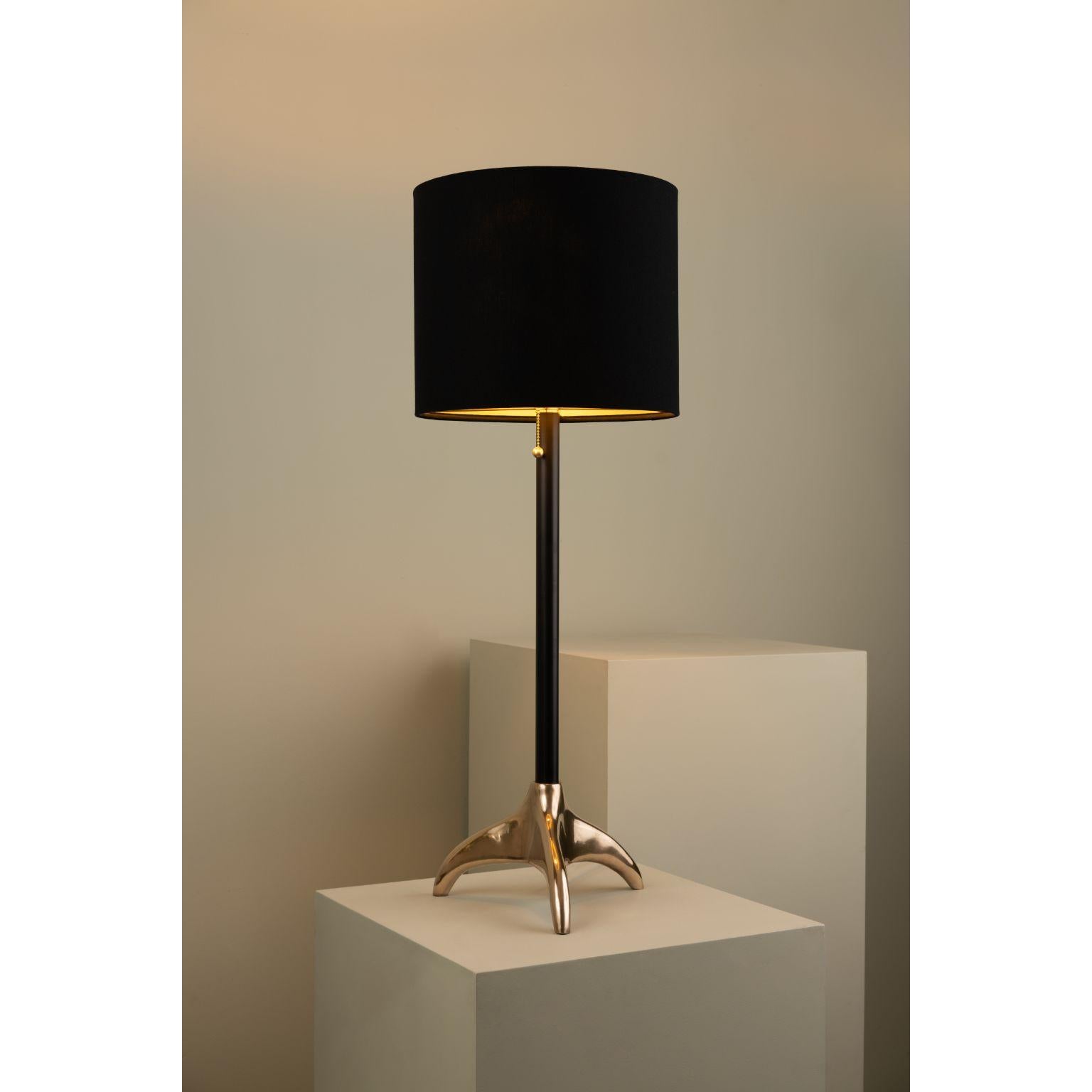 Rino Table Lamp by Isabel Moncada
Dimensions: Ø 35 x H 95 cm.
Materials: Copper, brass, linen and fiberglass.
Weight: 4.6 kg.

The base of the Rino fixture is a bronze sculpture that alludes to the shapes of
the triple antlers of the rhinoceros