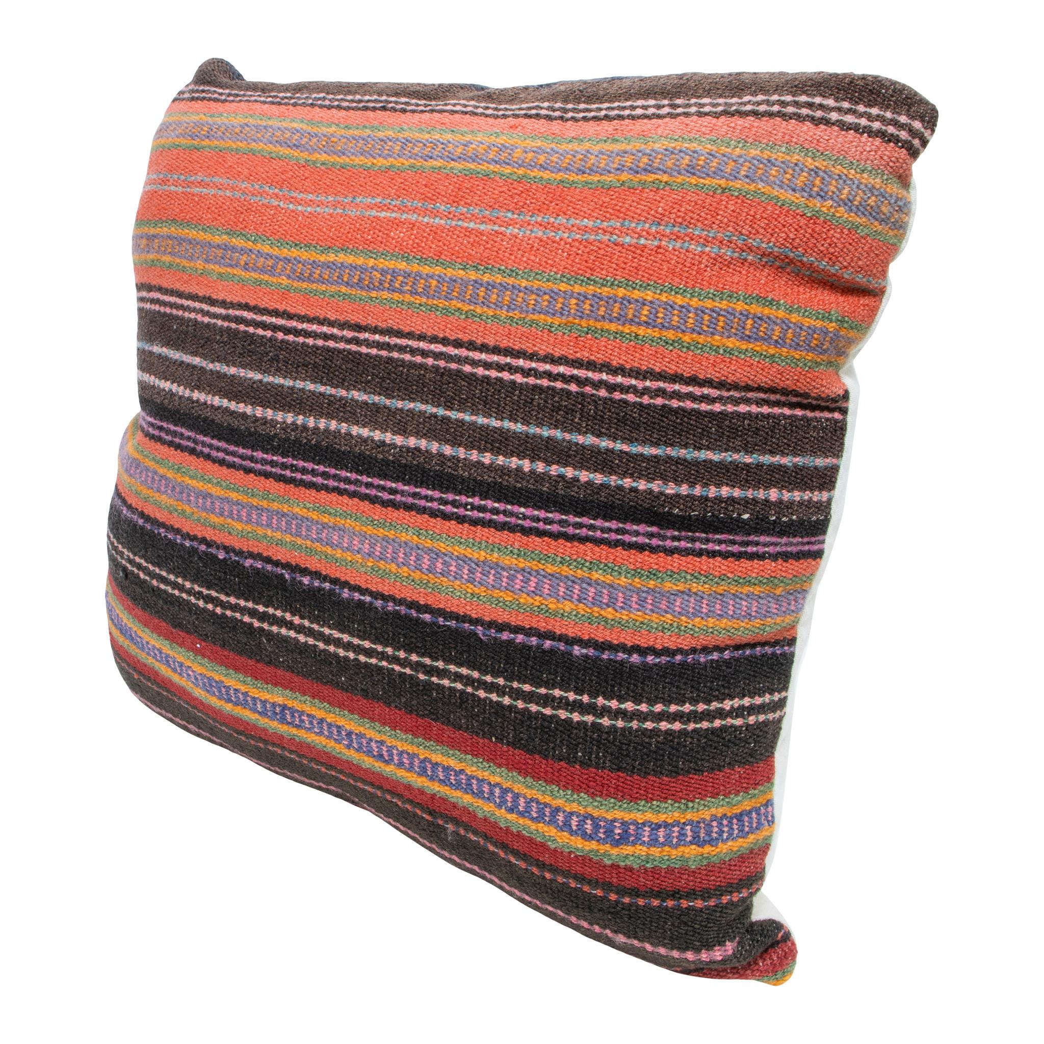 Rio grande weaving lodge pillow. Handmade pillow with front made of half Rio Grande 1880's weaving and half mid-toned leather. Backed with canvas. Featuring natural dyed colors of brown, blue, green, yellow, pink, purple, and black.

Family Owned &