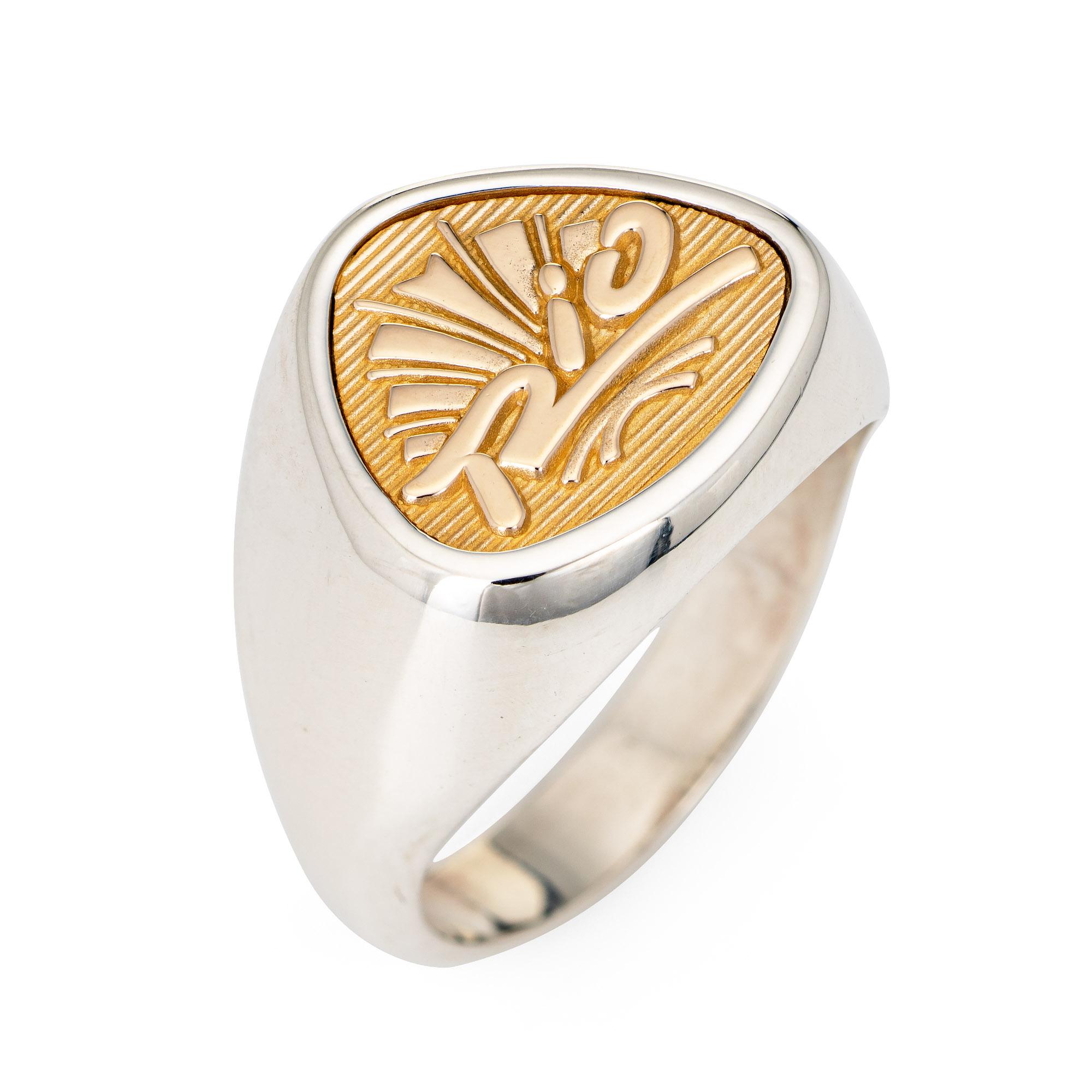 Unique vintage Rio Hotel signet ring crafted in sterling silver and 10k yellow gold. 

The Rio Hotel of Las Vegas emblem is depicted in 10k yellow gold and set flush into a sterling silver mount. The ring dates to 1994 and is engraved 