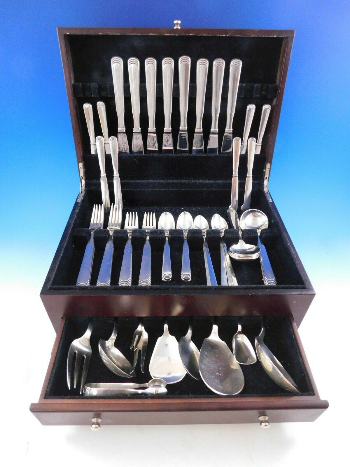 Dinner size ripple by Hans Hansen Danish sterling silver flatware set, 87 pieces. This set includes:

8 dinner knives, long handle, 8 7/8