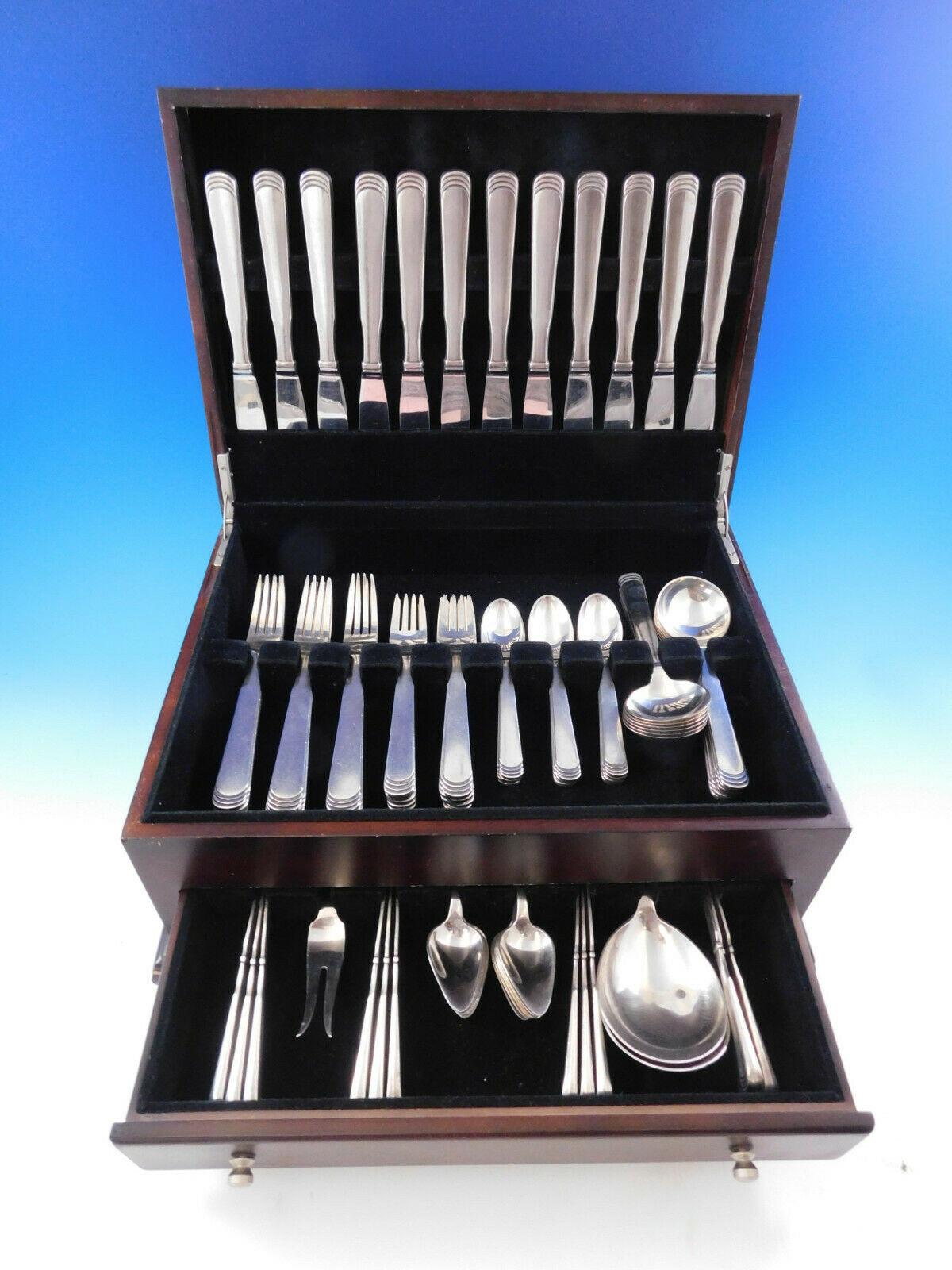 Dinner size ripple by Hans Hansen Danish sterling silver flatware set, 87 pieces. This set includes:

12 dinner knives, long handle, 8 7/8