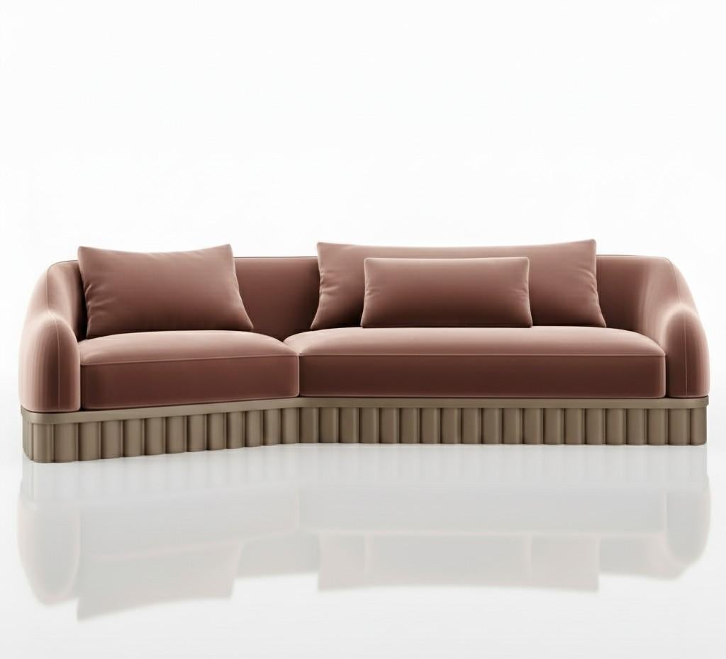 The Ripple sofa draws from the soft rhythm of water and air, vertical lines echoing ripples, pillars and sculpted silence. Its base anchors the form, while the upholstered seat floats above, creating a composition of balance, breath, and quiet