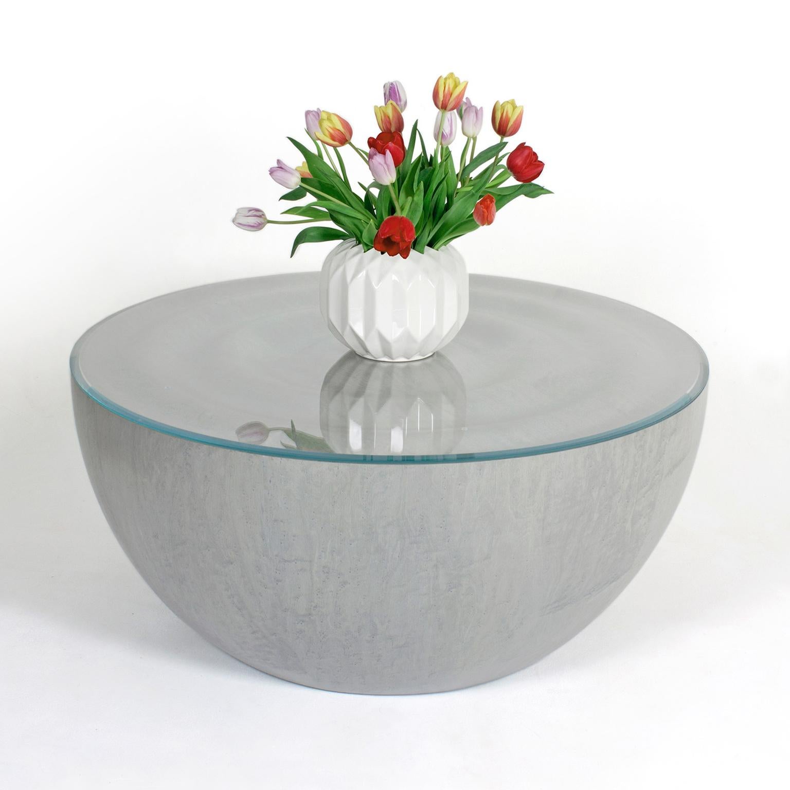 The contemporary rippled dome-shaped 'Splash' coffee table by Edward Johnson forms part of his Ripples Collection. Inspired by the action of a stone dropping into water, the principal intention was to produce a surface that could replicate the