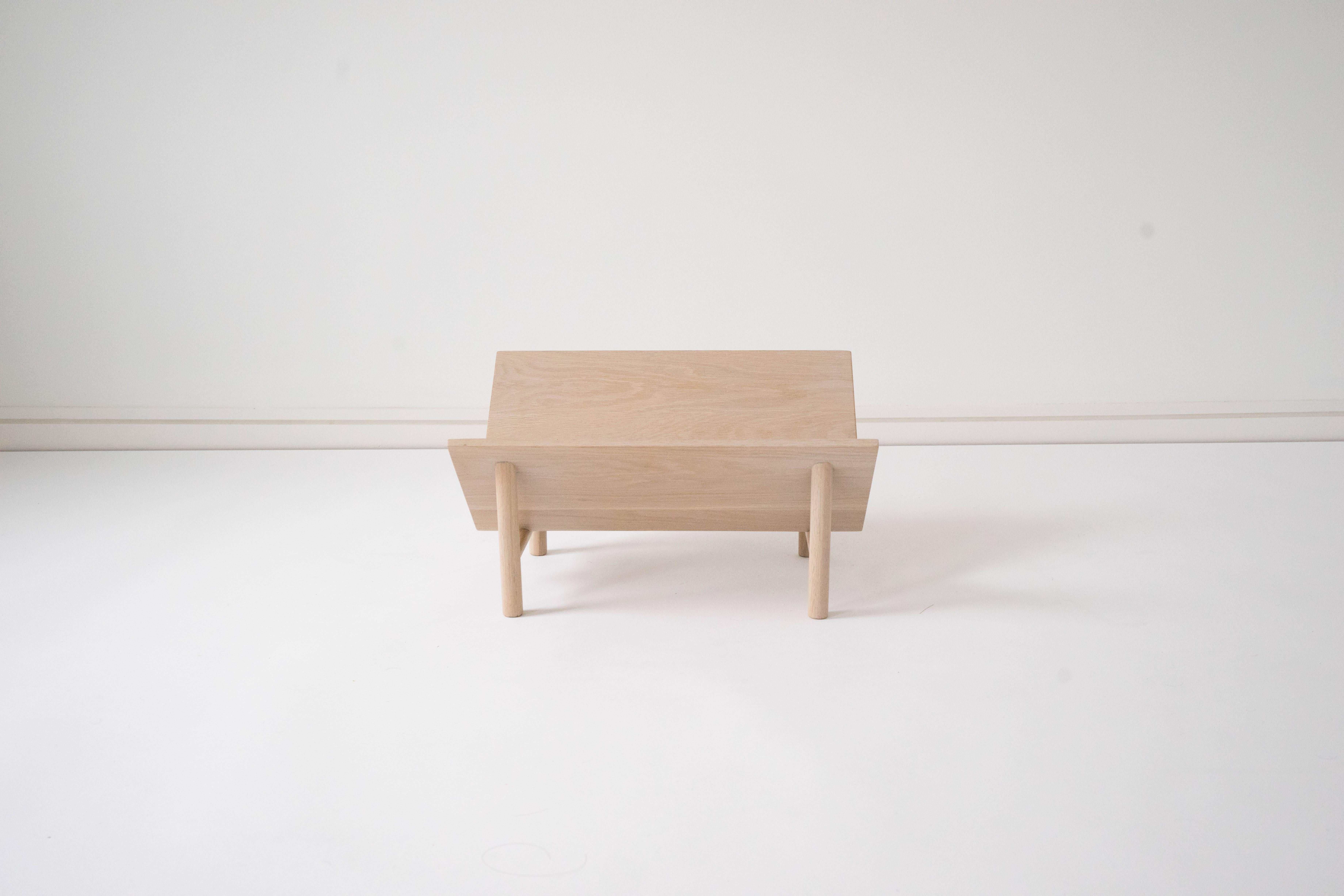 Sun at Six is a contemporary furniture design studio that works with traditional Chinese joinery masters to handcraft our pieces using traditional joinery. Handcrafted using traditional joinery. A floating stand for books, records, and display. Wide