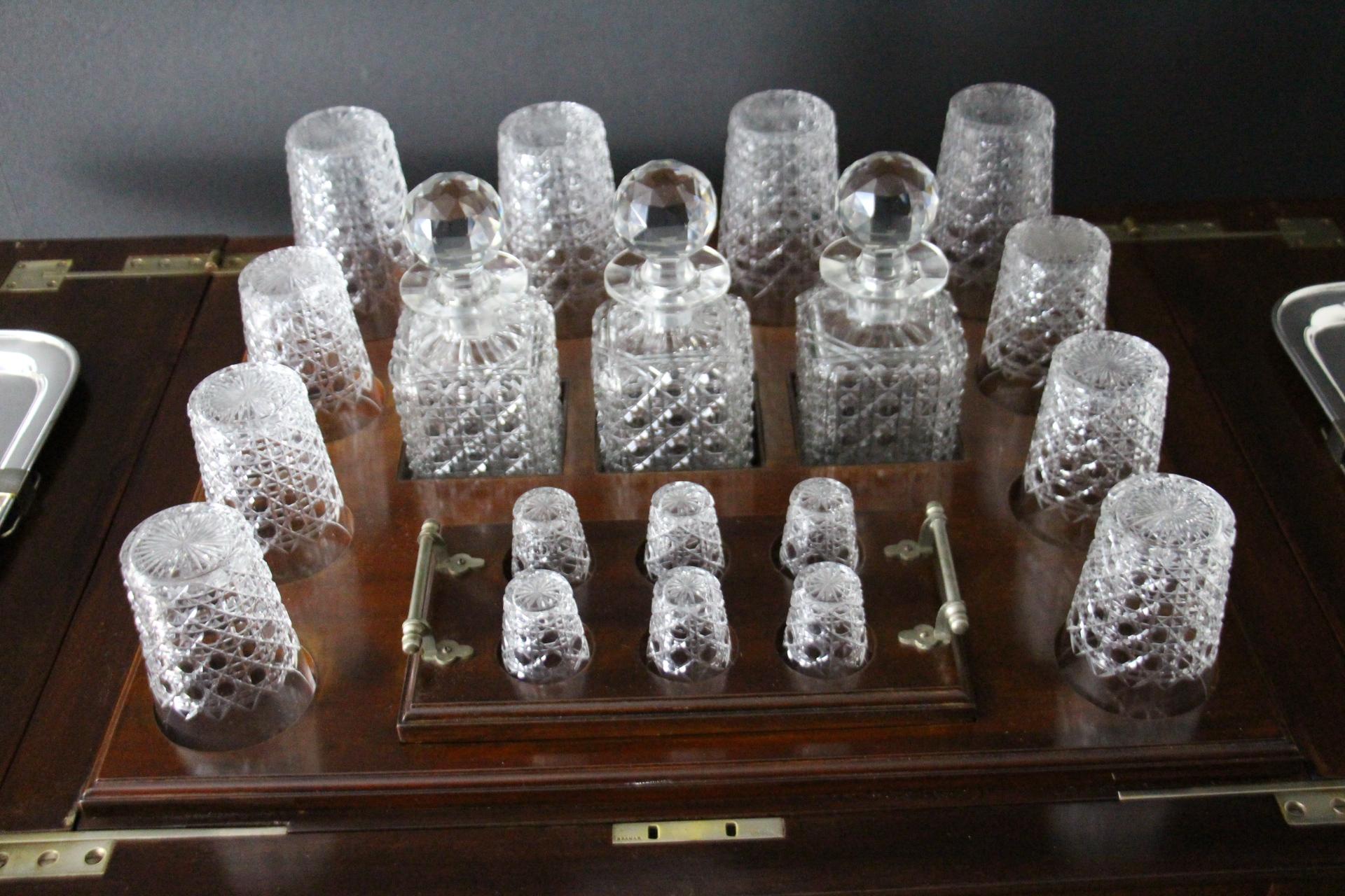 This English cocktail cabinet is particularly unusual  and elegant.
Made of honey color golden walnut, from 1910-1920's , it features 4 straight legs and storage compartment on each sides to store bottles and biscuits . Its top section pops up .It