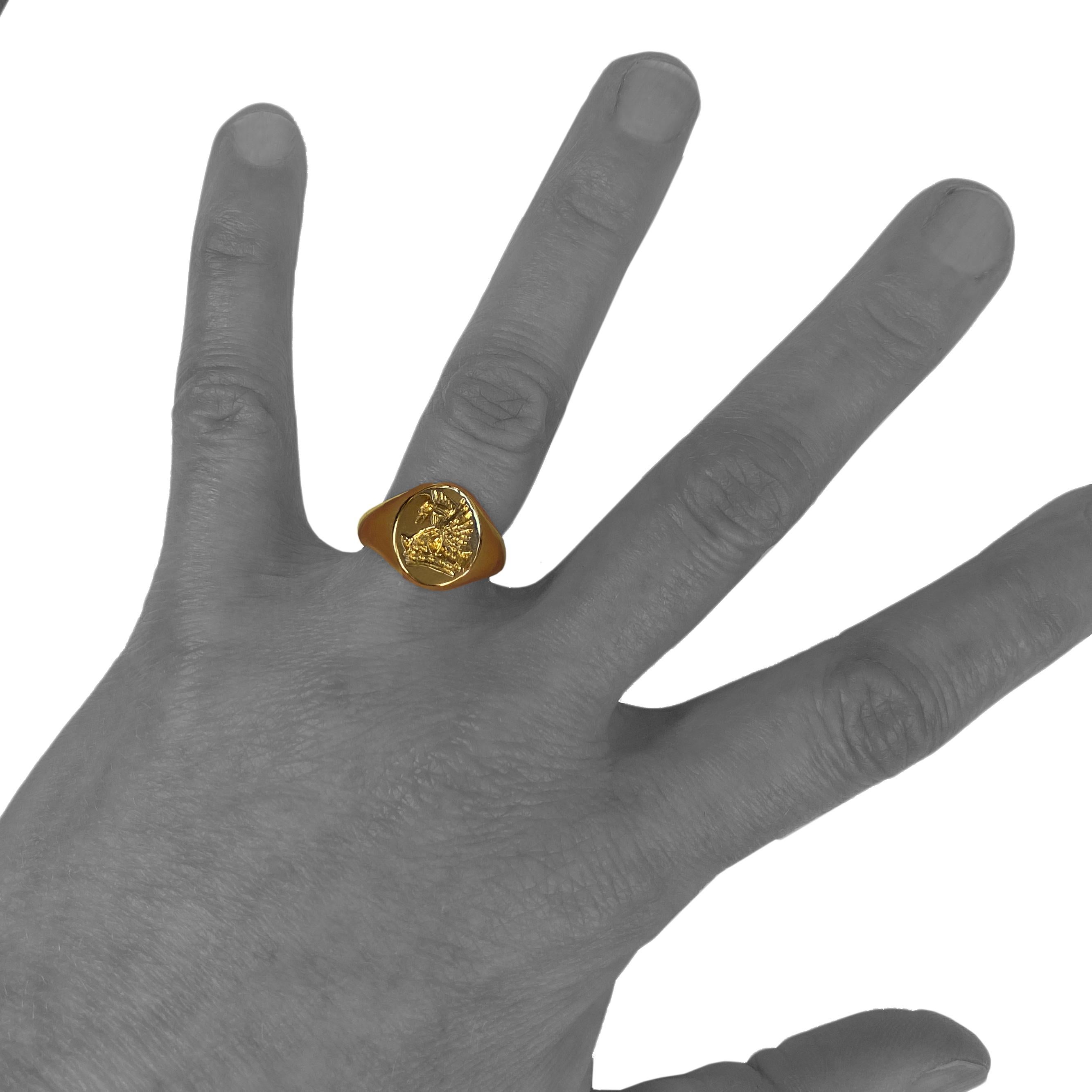This modern signet ring depicts a heraldic crown over which a  phoenix is reborn and rises from still-flaming ashes.  A classic symbol of rebirth, resurrection, regeneration, and rejuvenation -- the mythical embodiment of 