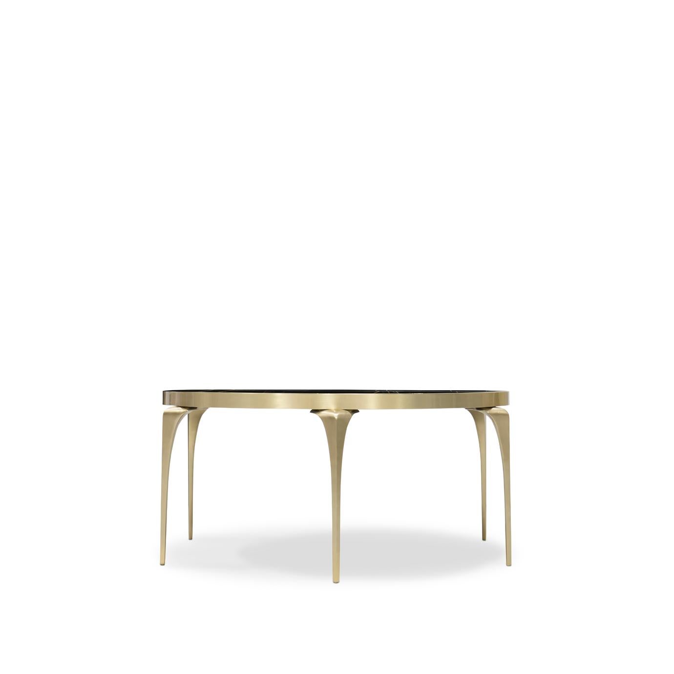 With its lux, polished black Sahara Noir marble top and satin brass legs the Rita Cocktail Table embody a sophisticated chic style. Simple yet modish, Rita is sure to bring a refined elegance to any room.