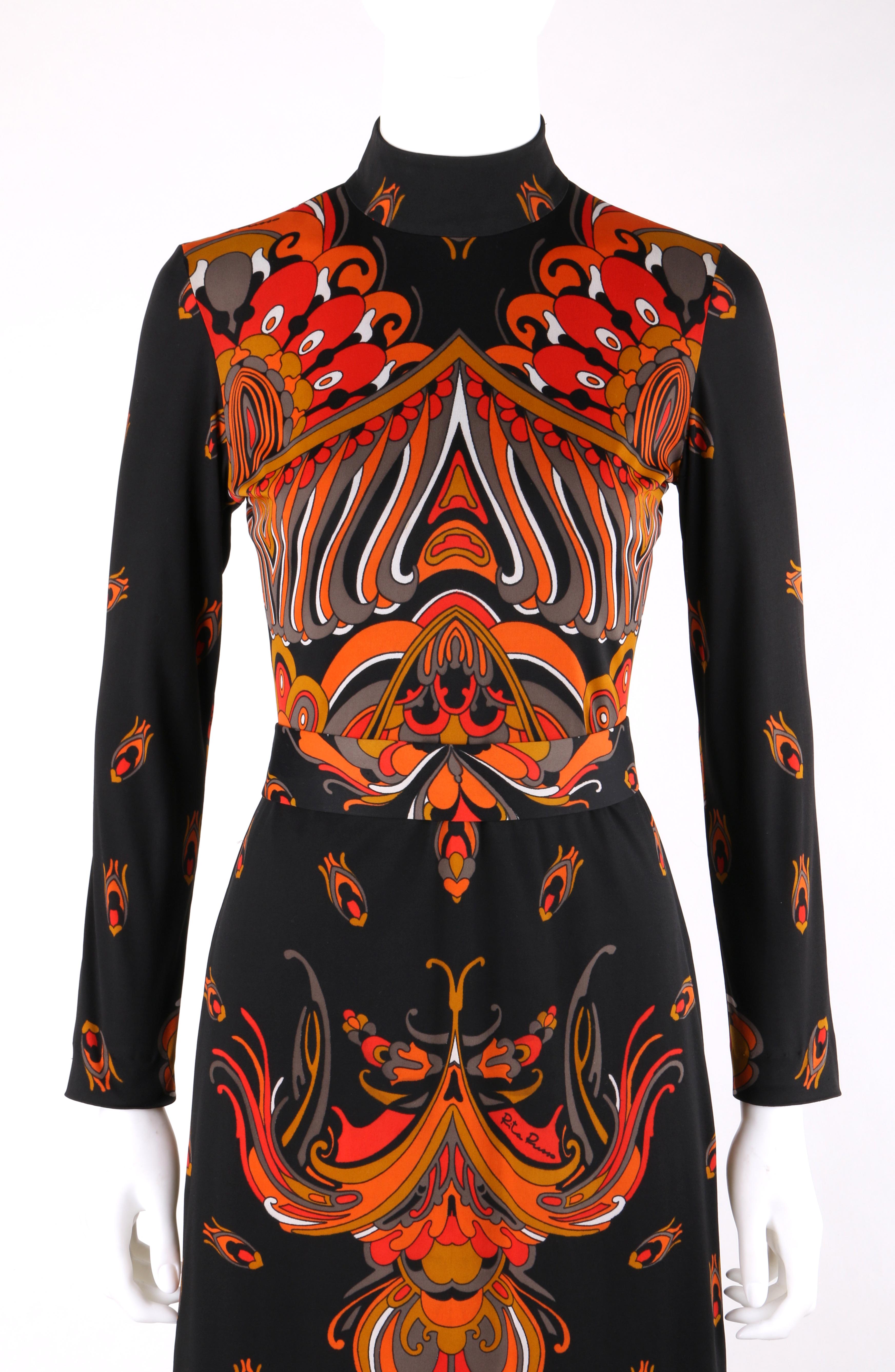 RITA RUSSO c.1970's Black Symmetrical Paisley Signature Print Belted Maxi Dress
 
Circa: 1970’s
Label(s): Rita Russo
Designer: Rita Russo
Style: Maxi dress
Color(s): Black, shades of orange, red, yellow, gray
Lined: No
Unmarked Fabric Content: