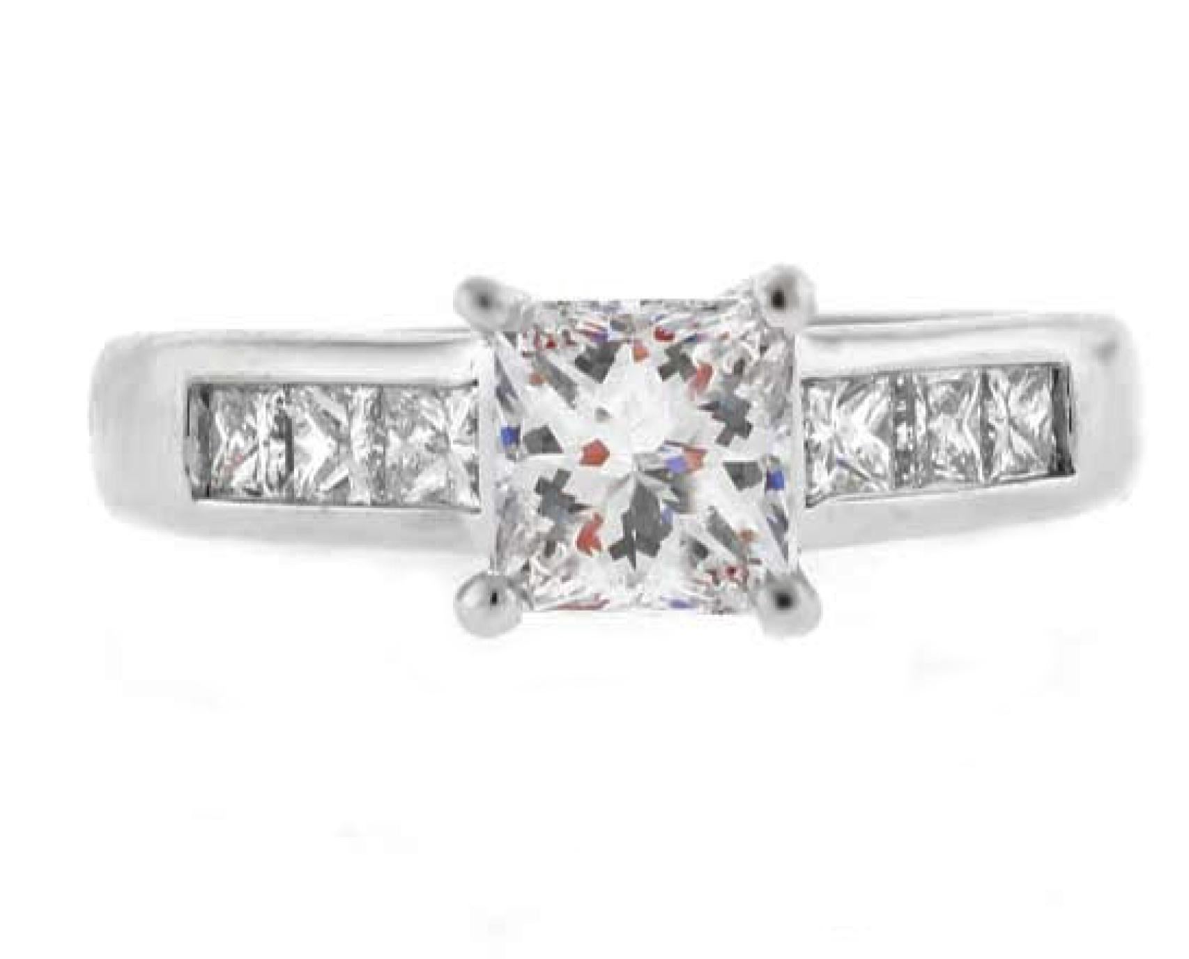 This Ritani 1.02-carat princess cut diamond engagement ring radiates brilliance and sophistication. The center stone, graded F color and VVS2 clarity (GIA #2211766791), is set in a sleek platinum Ritani setting. Complementing the centerpiece, six