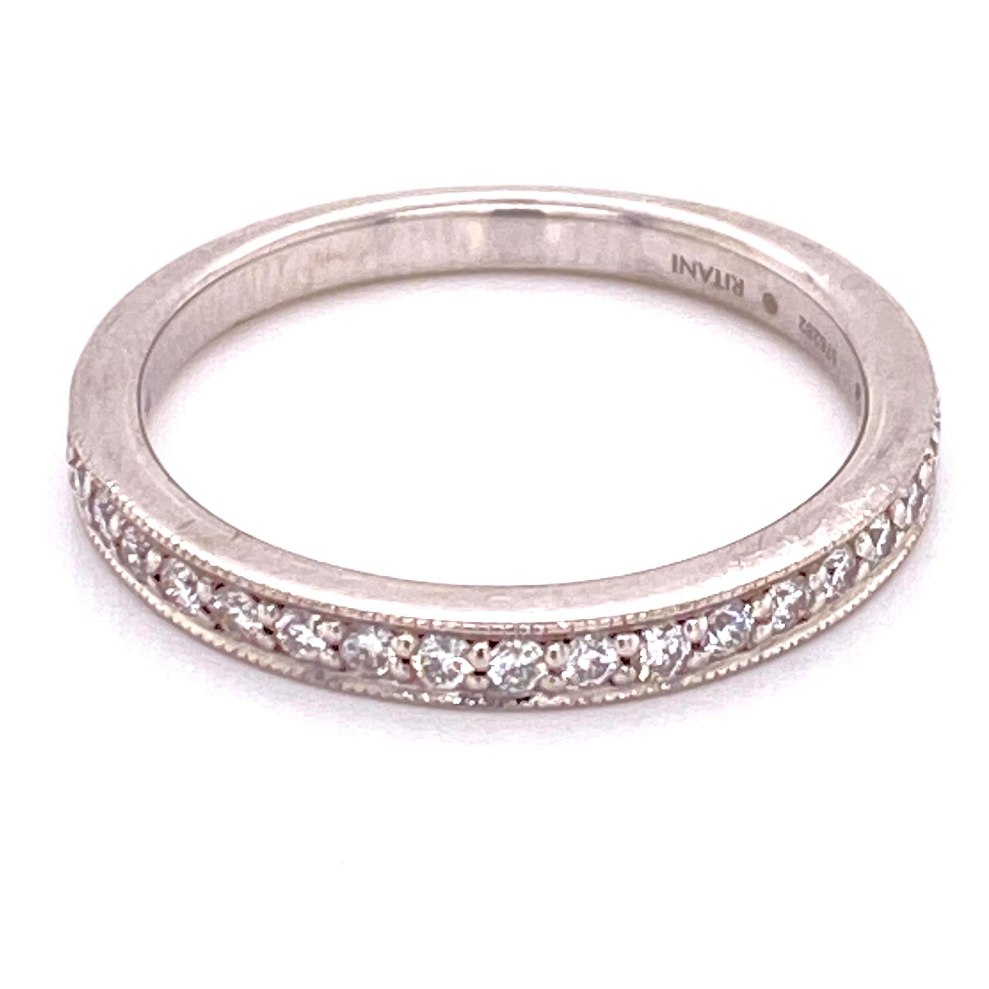 New Ritani diamond wedding band with a brilliant row of 20 round brilliant cut diamonds set with milgrain. There are .24 carat total weight of diamonds set in 18 karat white gold.  The ring is size 6.5 (can be sized), amd measures 2.3mm in