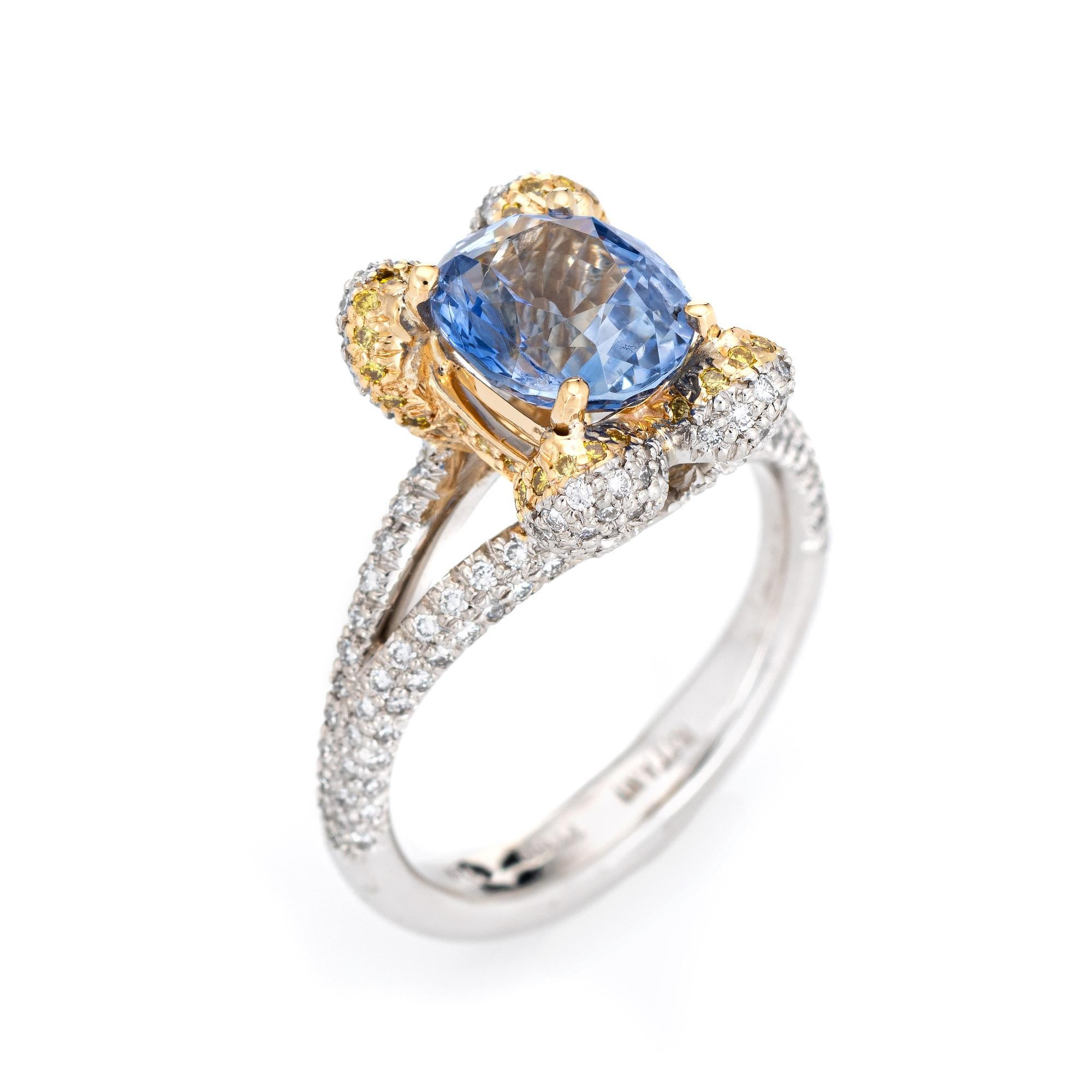 Stylish pre-owned Ritani natural cornflower blue sapphire & diamond gemstone engagement ring crafted in 18 karat yellow gold and platinum. 

Oval faceted cornflower blue sapphire is estimated at 3.26 carats, accented with an estimated 0.75 carats of