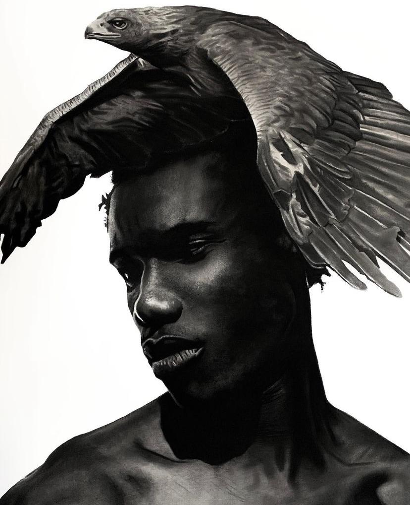 This powerful image depicts a portrait of a young Black man rendered in black and white, using charcoal and acrylic mediums. 

Adding a dynamic element to the composition, a large bird, possibly an eagle or hawk, is perched atop his head. The bird
