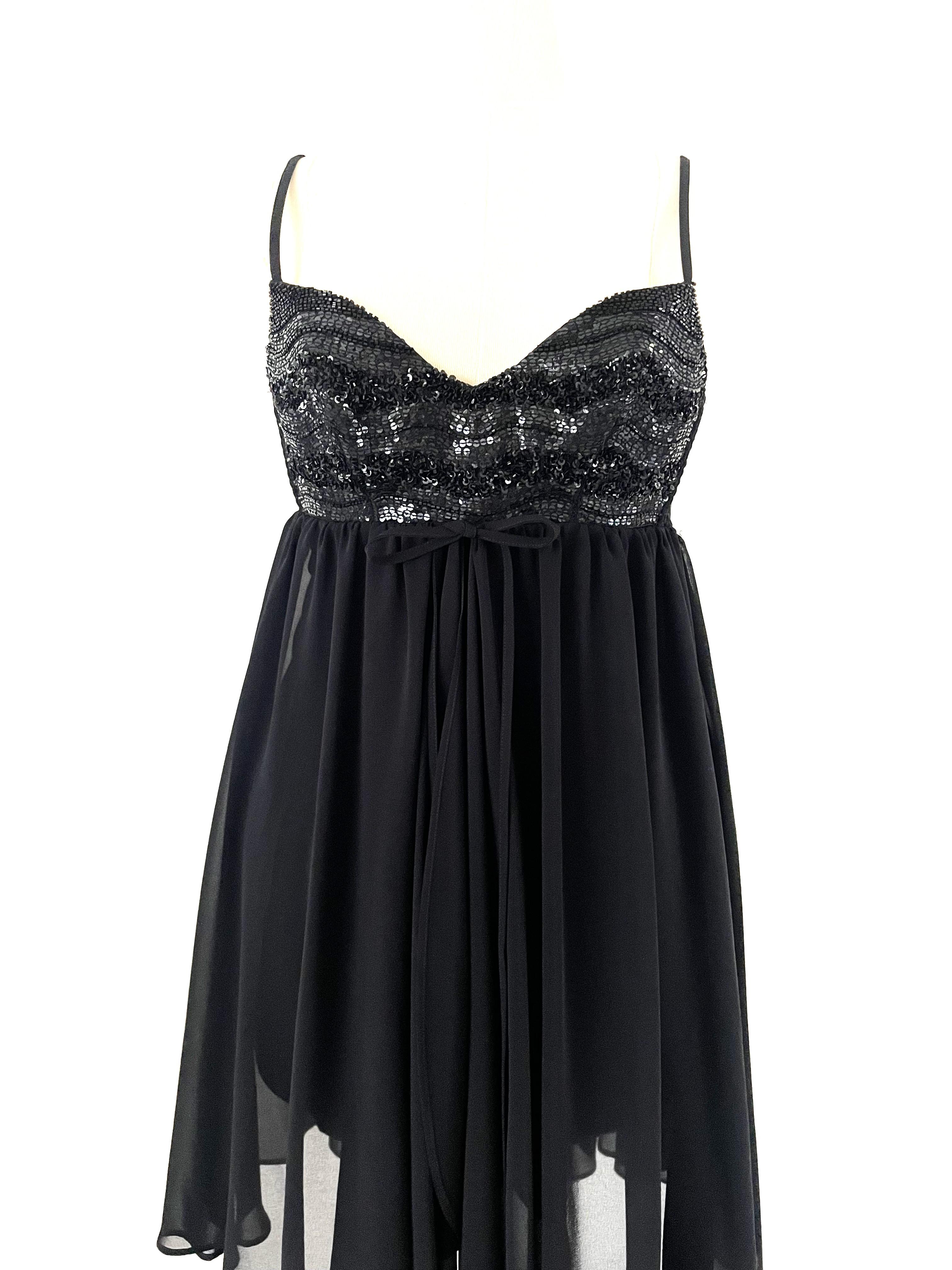 Step into timeless elegance with this stunning vintage black cocktail dress from Perla Ritmo di Perla from our private collection.  Expertly crafted, this piece features a sophisticated chiffon overlay that drapes gracefully, adding depth and