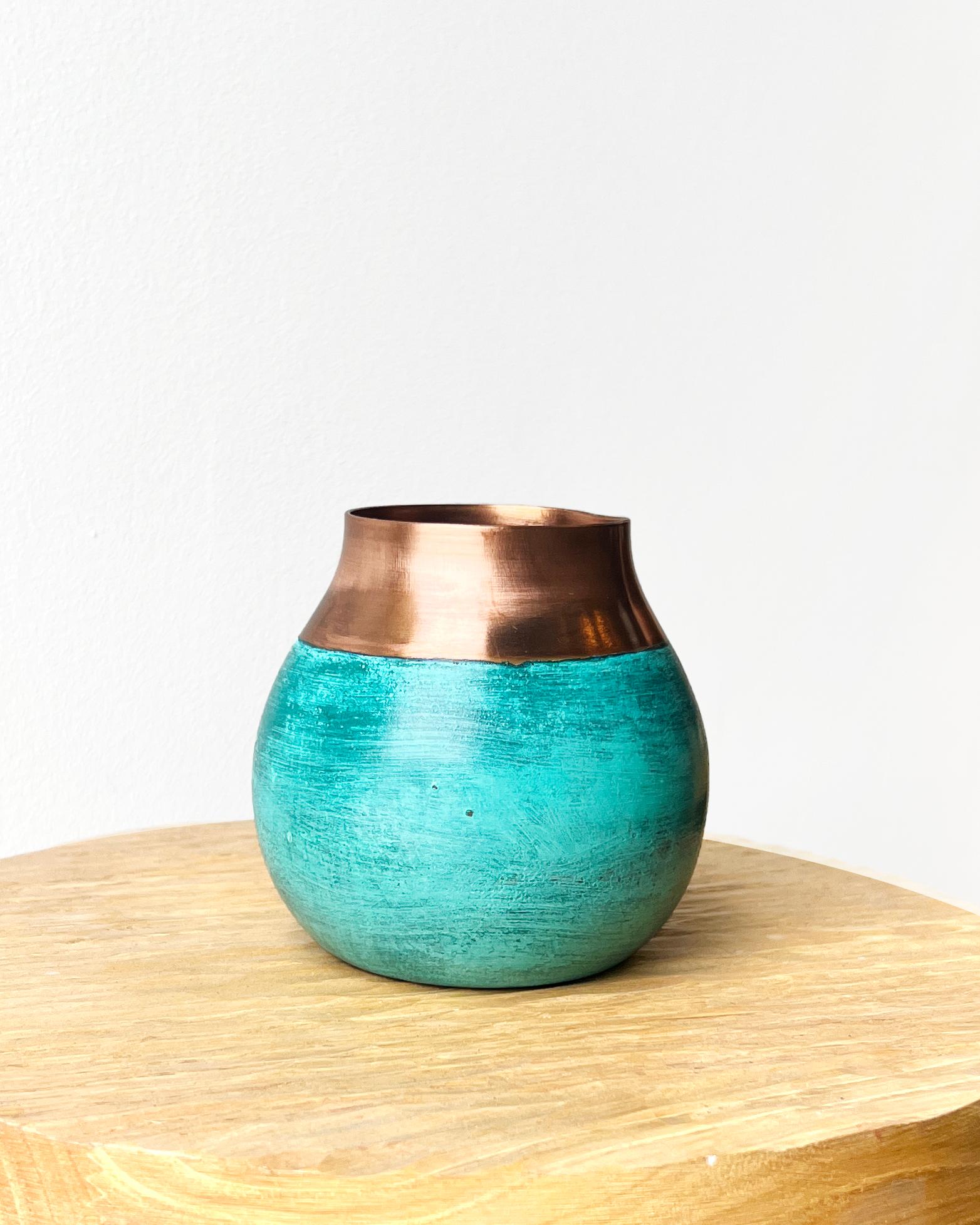 A copper accent to brighten your home
Introducing the Ritual Mate Cup: the perfect accent piece for any home. This unique copper cup is modeled after the traditional gourd used to drink mate. The green patina finish gives it an antique look, making