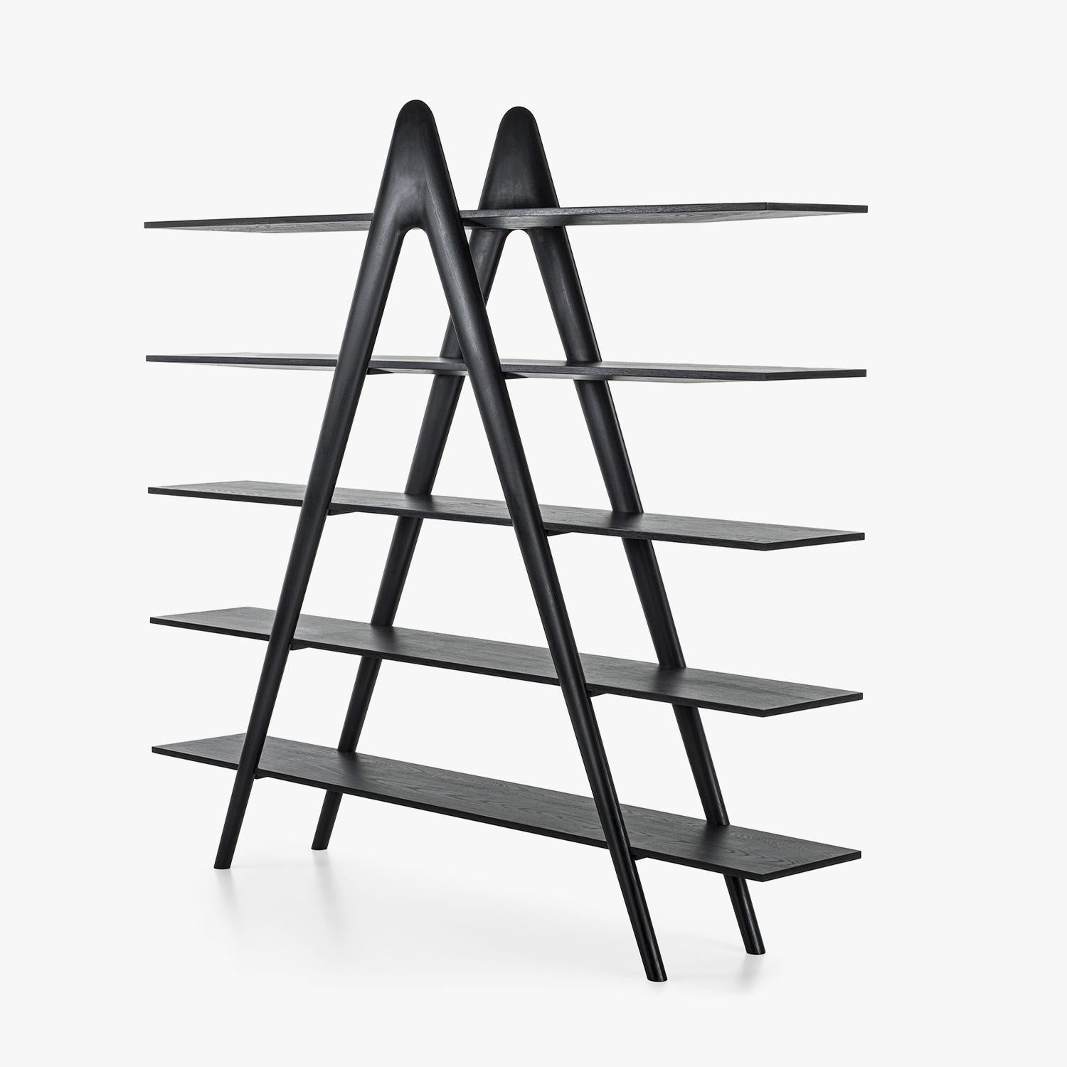 The A-Book Bookshelf, designed by Fabio Di Bartolomei for Riva 1920 in 2025, is a striking synthesis of sculptural form and functional elegance. Crafted from solid oak with a refined Total Black finish, this bookshelf elevates the display of books