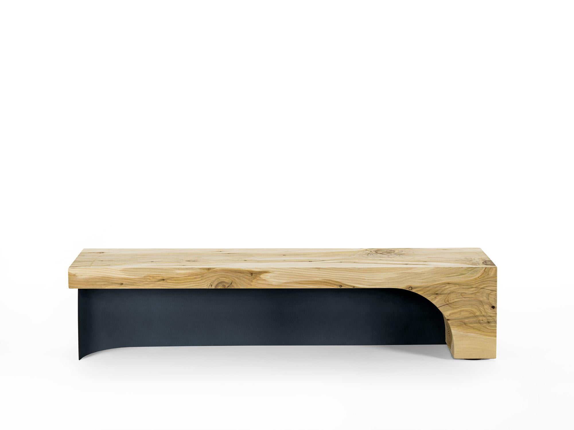 Riva 1920 BECCO Bench
Design: Alessandro Oberti

The BECCO Bench is carved from a single block of scented solid cedar and distinguished by its slender, sculptural silhouette, reminiscent of the elegant profile of a swan's beak.

Its design is