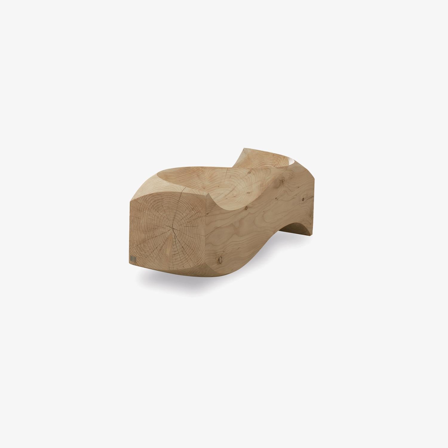 The Love Seat Bench, designed by Jake Phipps for Riva 1920, is more than a piece of furniture—it is a symbol of connection, intimacy, and shared perspective. Carved from a single block of scented solid cedar wood, it radiates natural warmth and