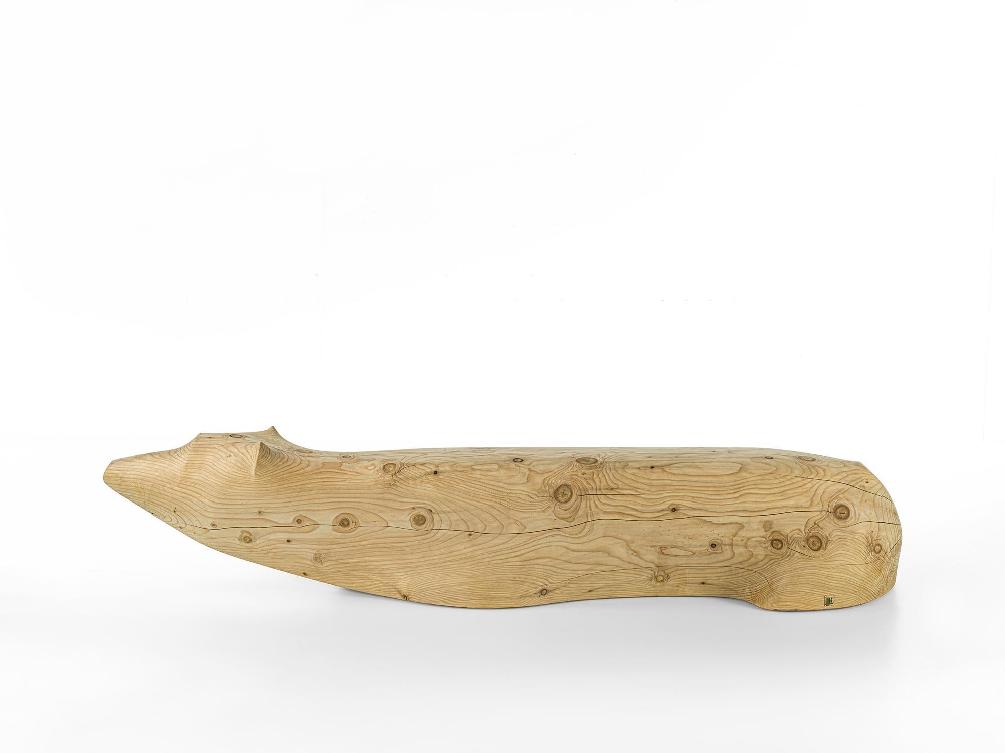 Riva 1920 NOT TOO LATE Bench
Design: Silvio Consentino

The NOT TOO LATE Bench is a powerful piece carved from a single block of scented solid cedar. Its design draws inspiration from the figure of a polar bear half-submerged in water, serving as a