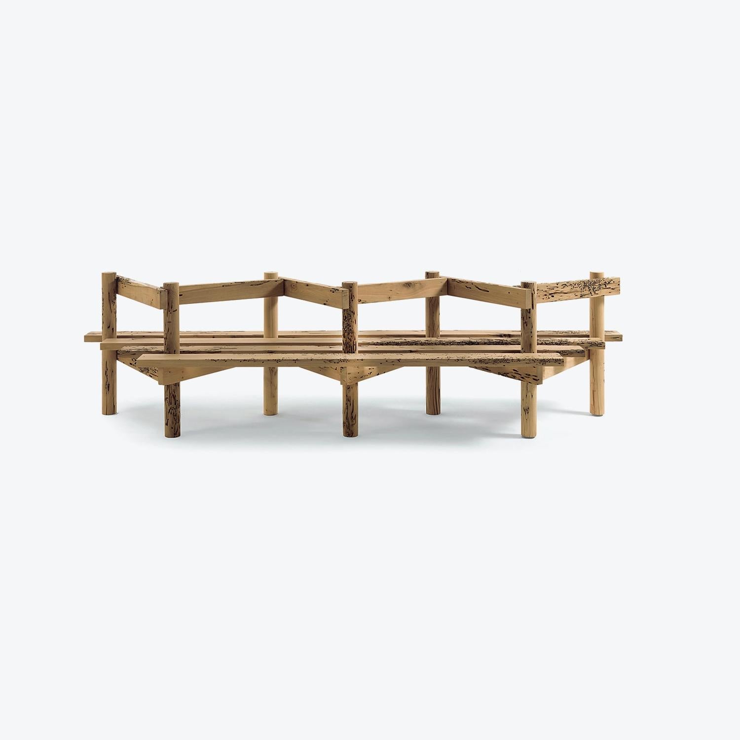 The Palizzata Bench, designed by Michele De Lucchi for Riva 1920, is a masterpiece of ecological design and craftsmanship, crafted entirely from solid Briccola wood. These iconic oak poles, sourced from the Venetian Lagoon, are essential for