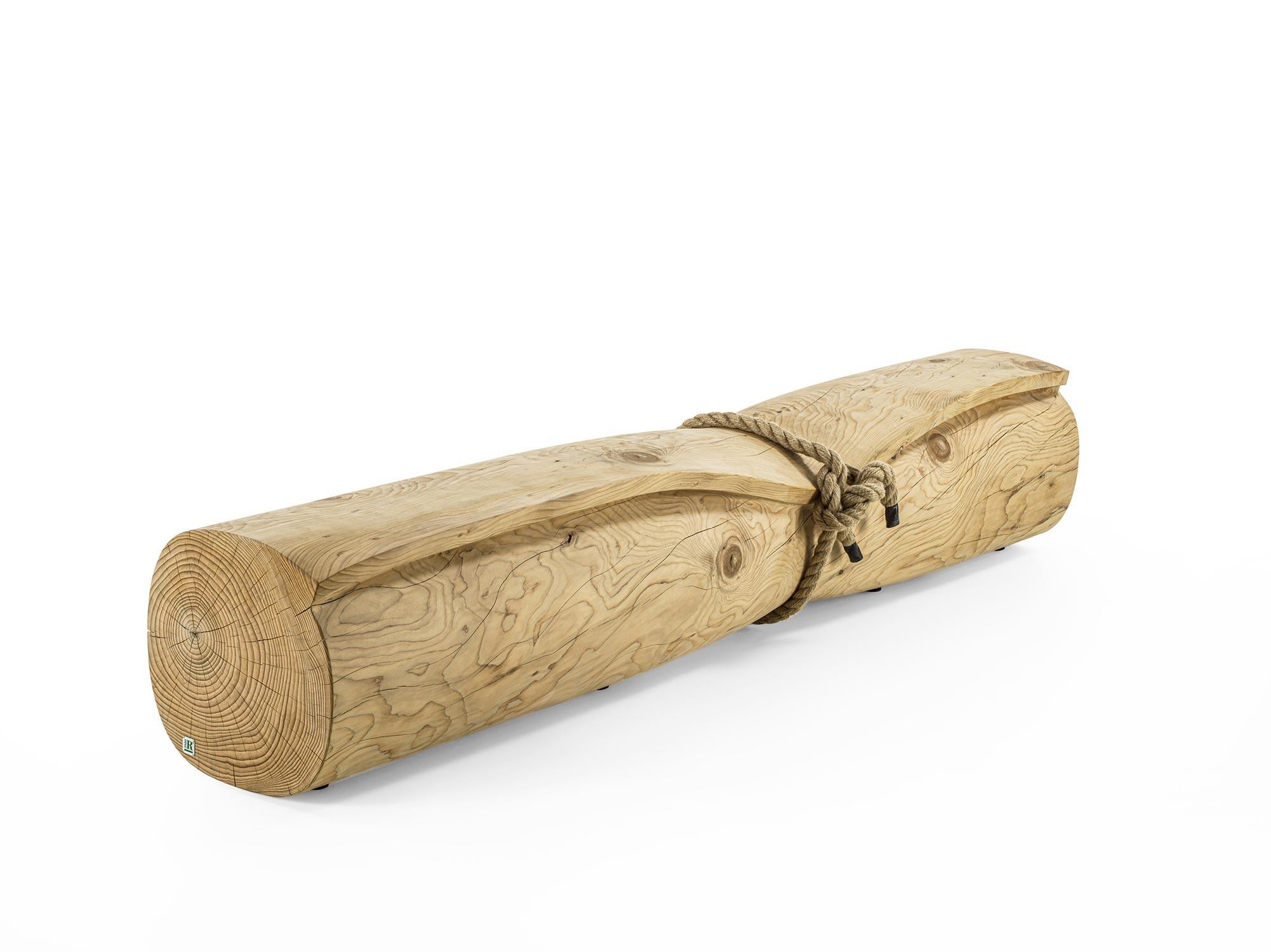 Riva 1920 WRAP Bench
Design: Lualdi Meraldi Studio

The WRAP Bench is a sculptural piece carved from a single block of scented solid cedar. Its design stands out for its sinuous, enveloping form, inspired by a sheet of paper gently rolled into
