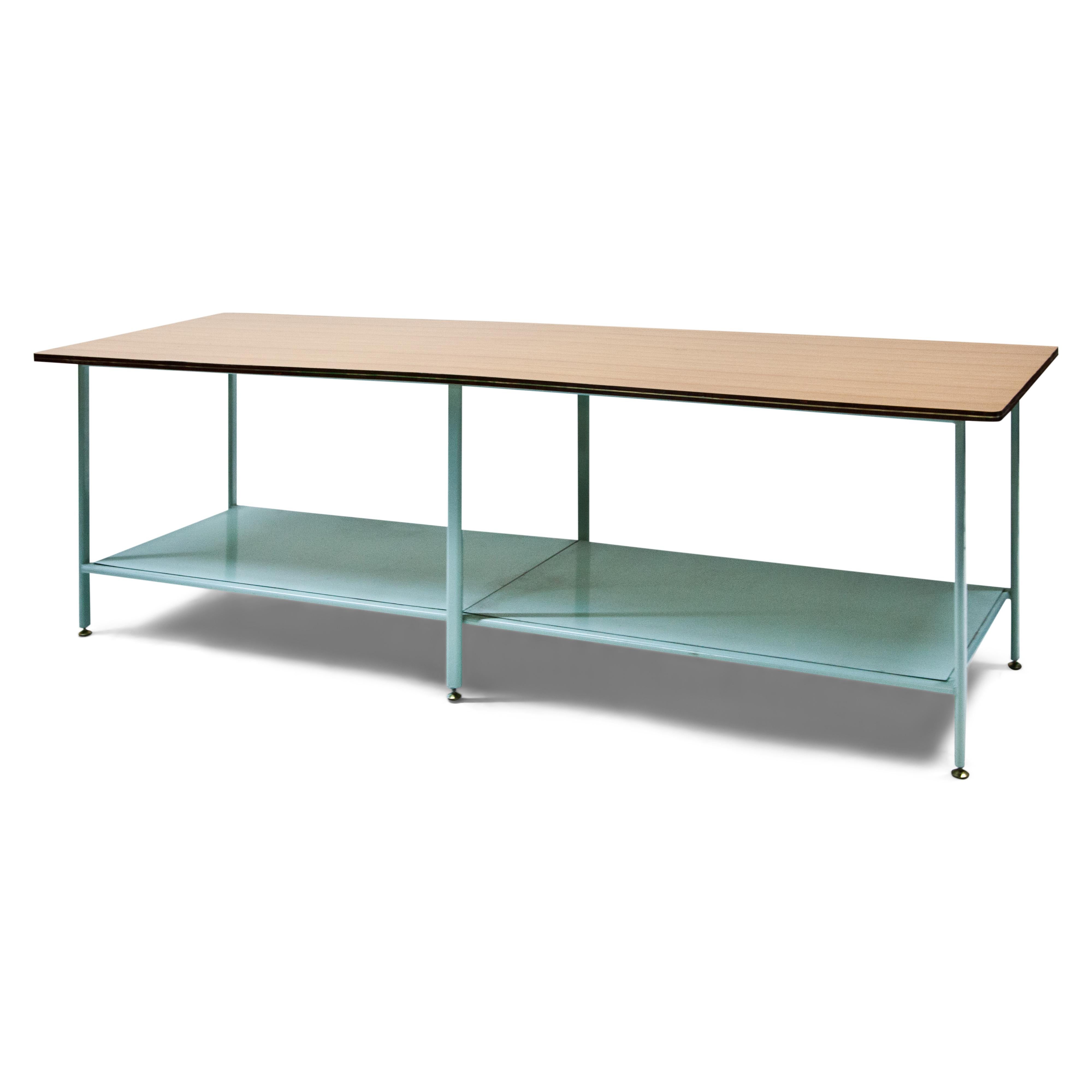 Two worktables on a light blue metal frame with shelf and veneered tabletop with brass thread inserted on the edge, in the style of the Riva boats. These tables came from the same workshop.