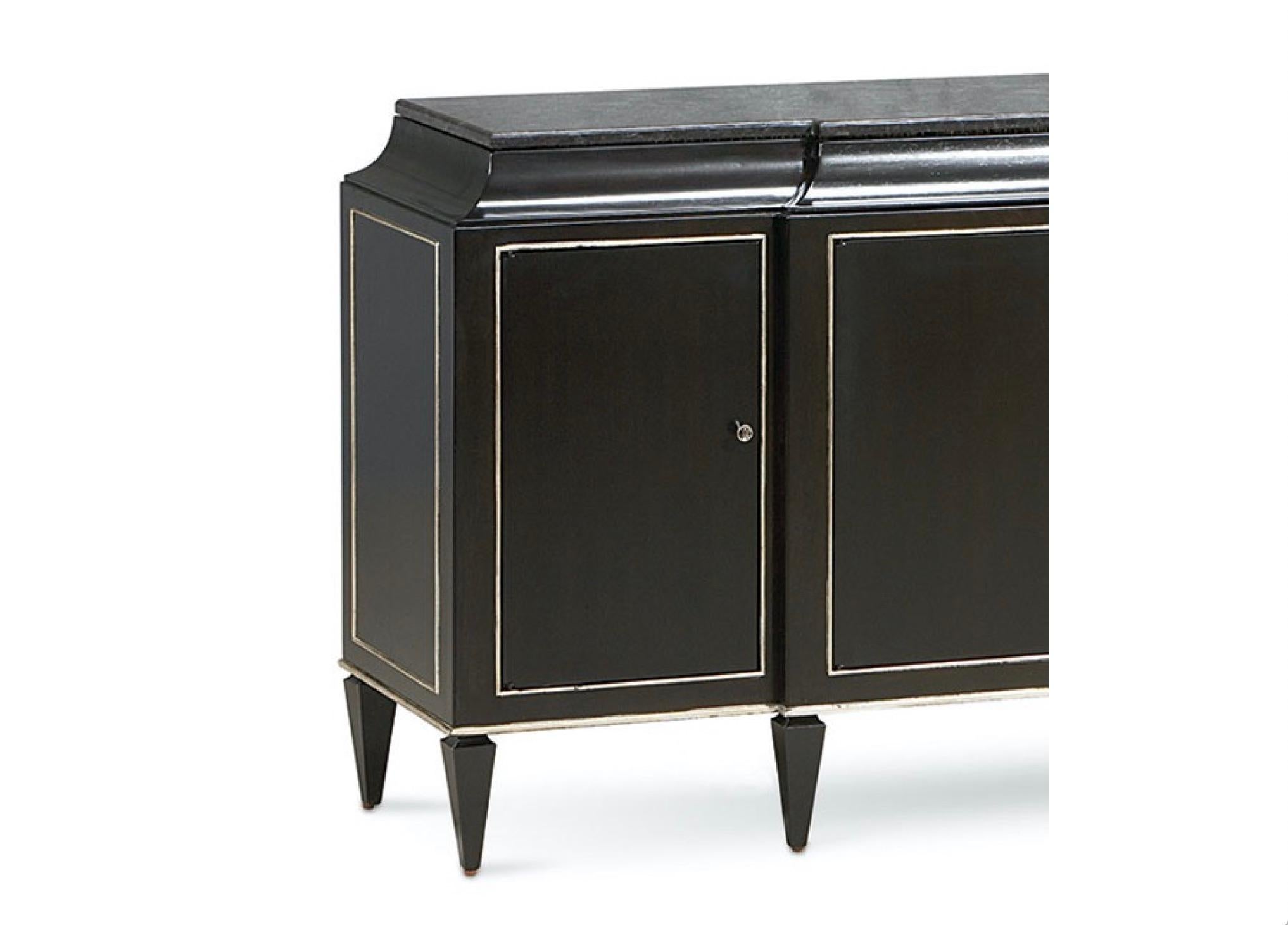 Listed is a stunning, glam caracole sideboard buffet cabinet from the Rive Gauche collection, circa 2016-2017. Handcrafted construction of solid woods and maple veneers, in a dark espresso finish. Black granite stone top. Plenty of storage with four
