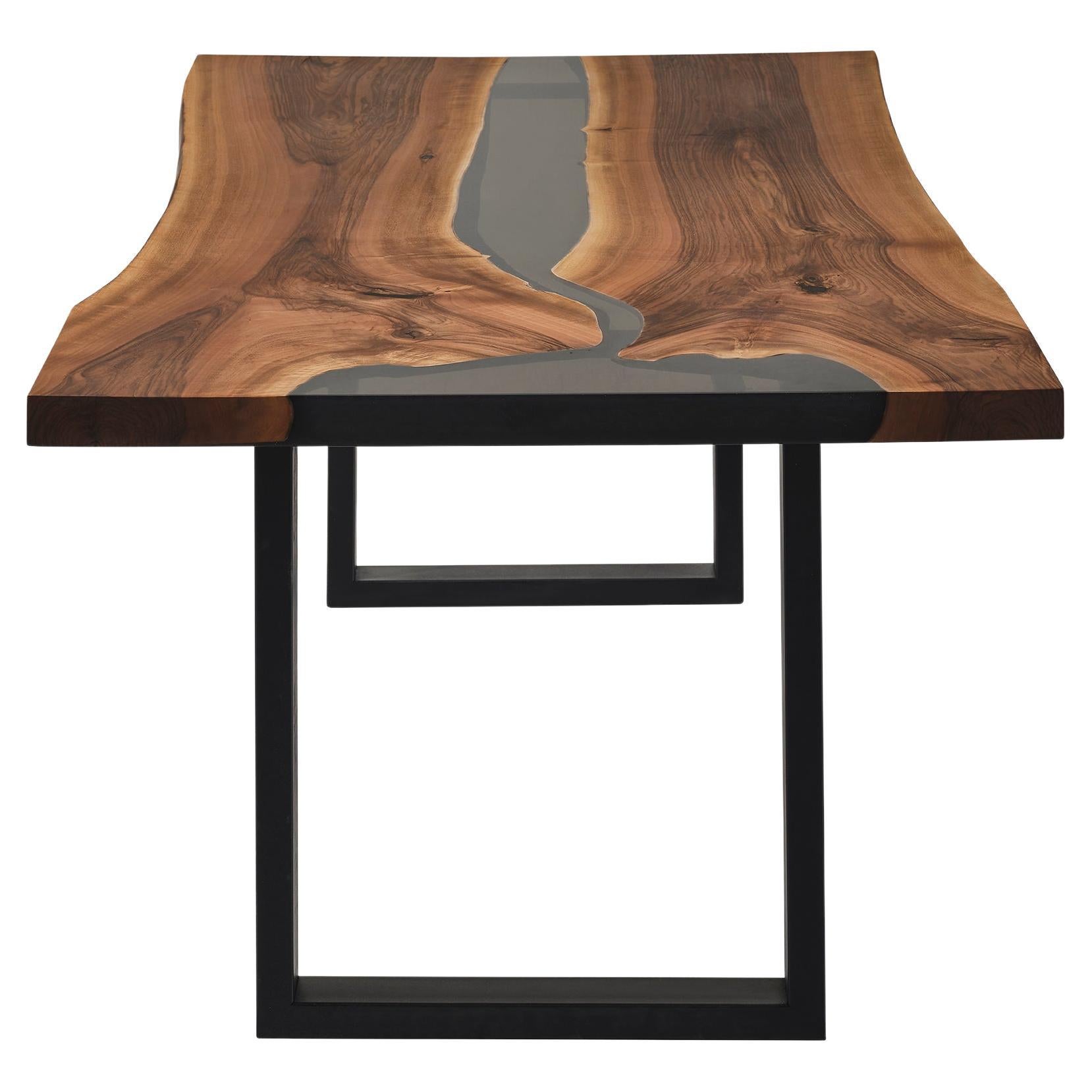WALNUT  DINING TABLE

This epoxy table emerges as a unique work of art, inspired by nature's beauty. 

The epoxy table stands out not only for its design but also its durability. Thanks to its epoxy coating, it is highly resistant to water and