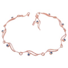 Bracelet torsadé en or 18 carats avec saphirs bleus et roses fluo