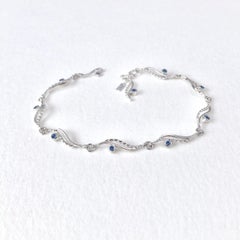 River-Rose Twist Flow Bracelet with Blue Sapphire 18 Karat