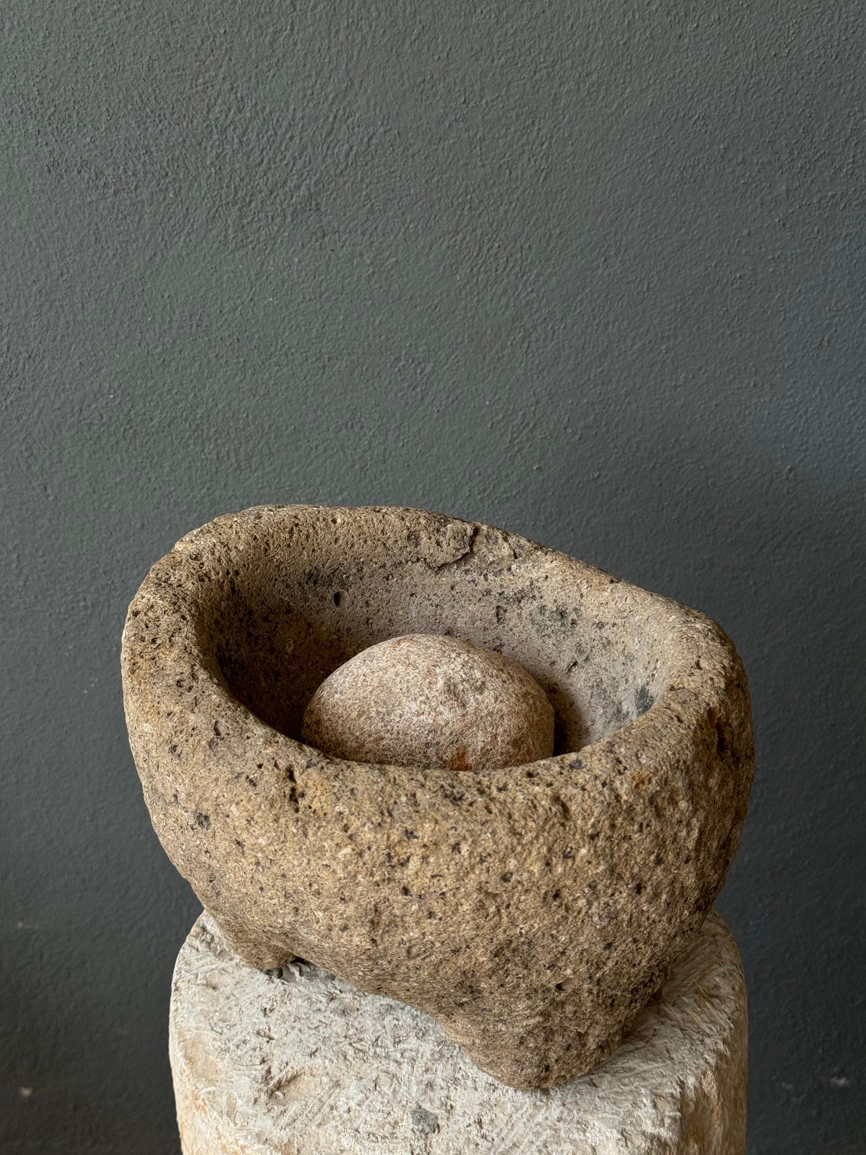 River stone mortar with round pestle grinder from San Luis Potosí, Mexico, circa mid 19th century. 
