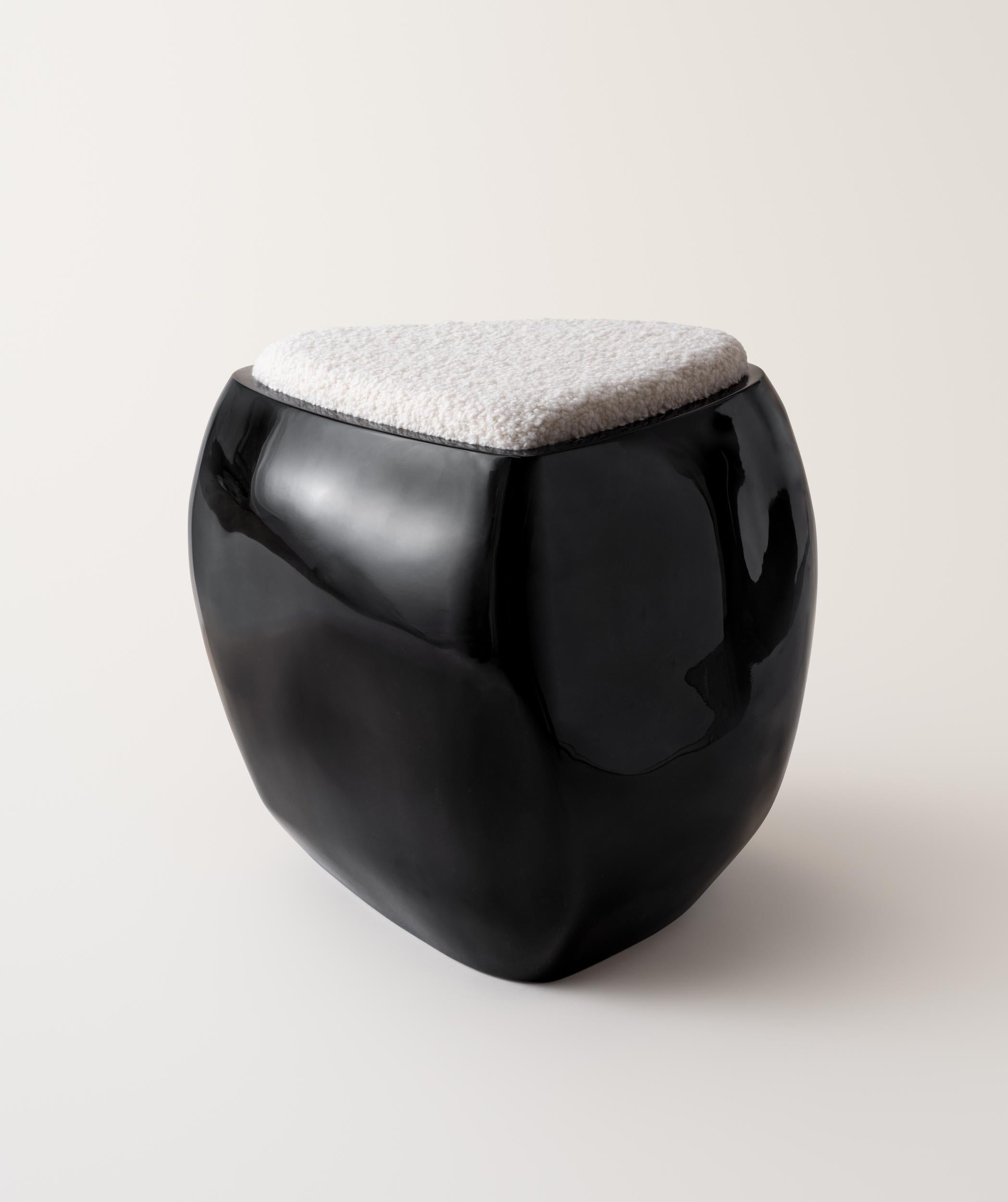 Inspired by stones shaped and polished by ever-evolving bodies of water, the River Stool presents a sculptural, asymmetrical form made up of soft curves and lines. The stool is expertly made by hand-layering fiberglass and gel coat over several
