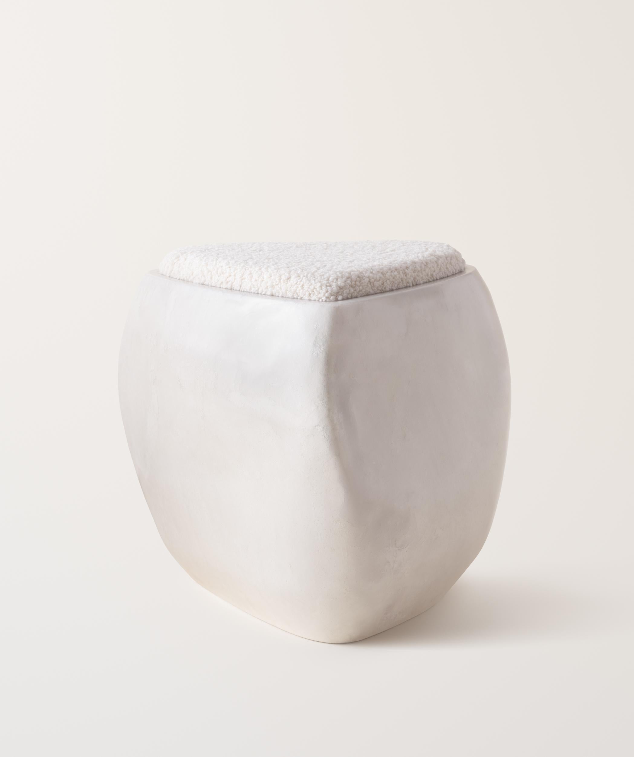 Inspired by stones shaped and polished by ever-evolving bodies of water, the River Stool presents a sculptural, asymmetrical form made up of soft curves and lines. The stool is expertly made by hand-layering fiberglass and gel coat over several