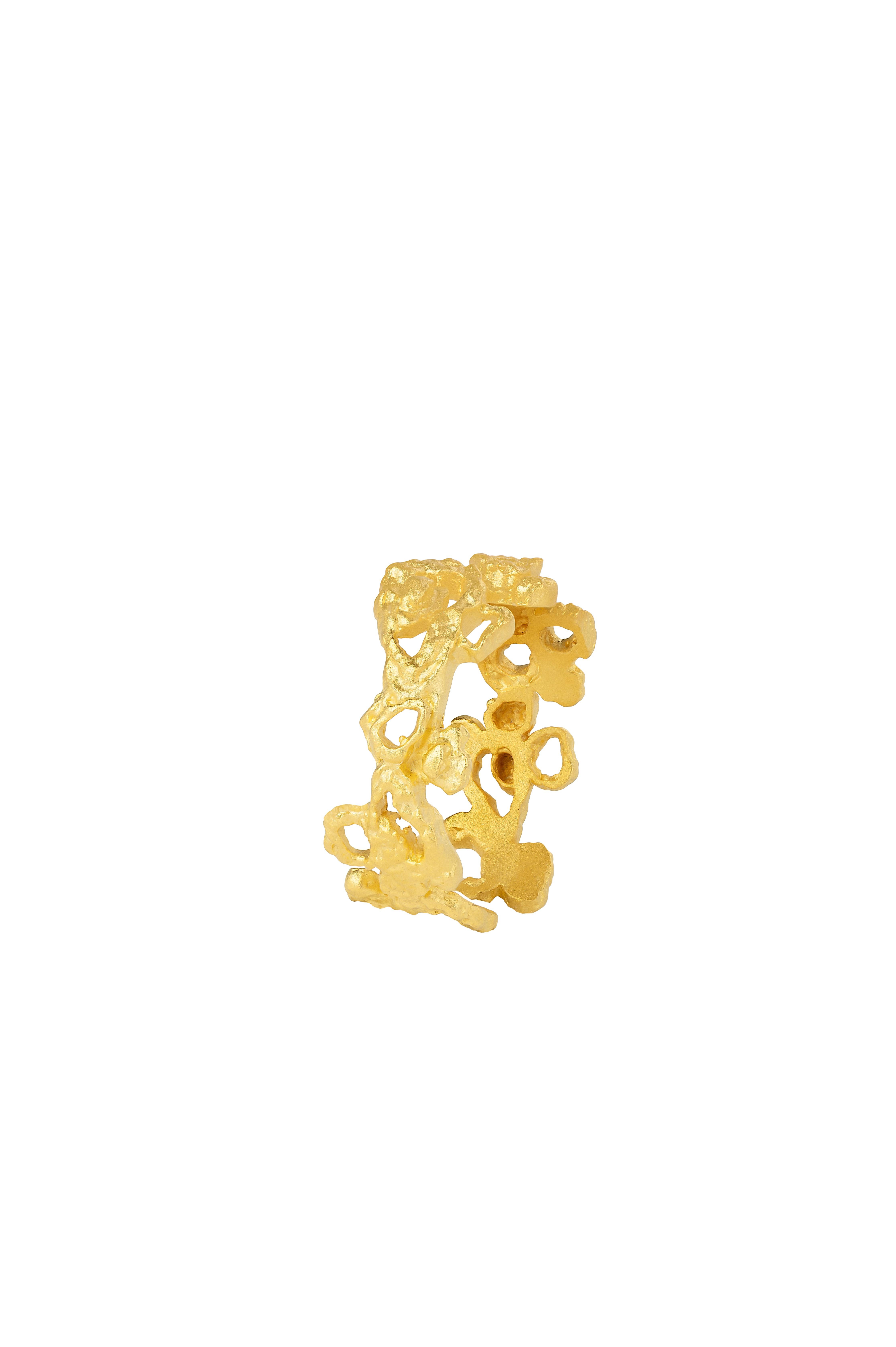 Product Details
A ring of textured shapes in a cluster that coil around the finger. The Riverstone Ring is a metaphor for the flow of the river and the robustness of the stones surrounding it.  Open-ended for adjustability. 

Materials
Brass dipped